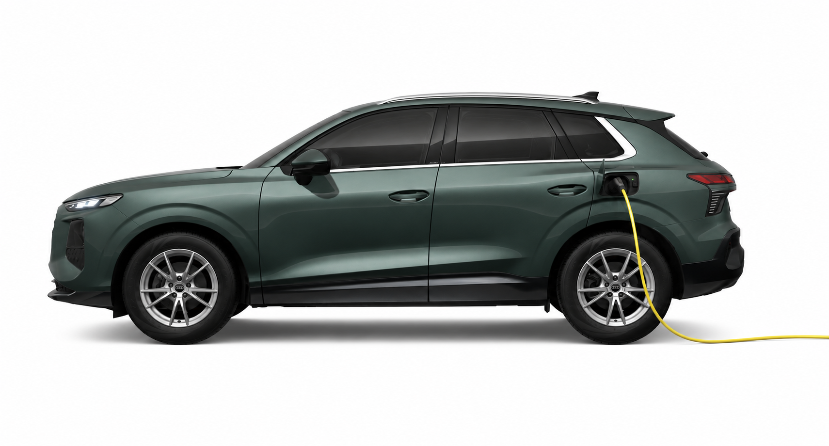 SUV elétrico verde-escuro ligado ao cabo de carregamento