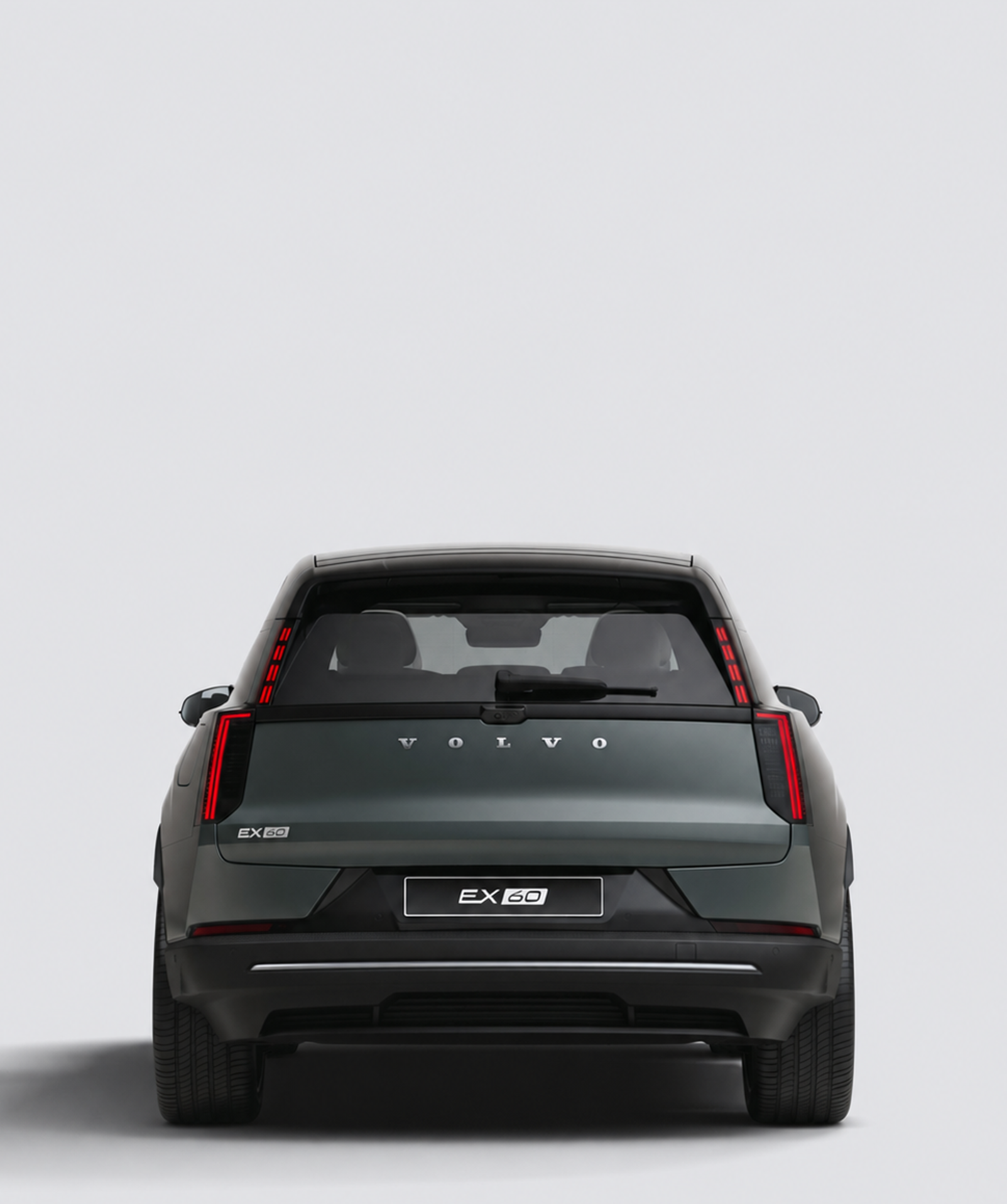 Volvo EX60 elétrico cinzento, vista traseira