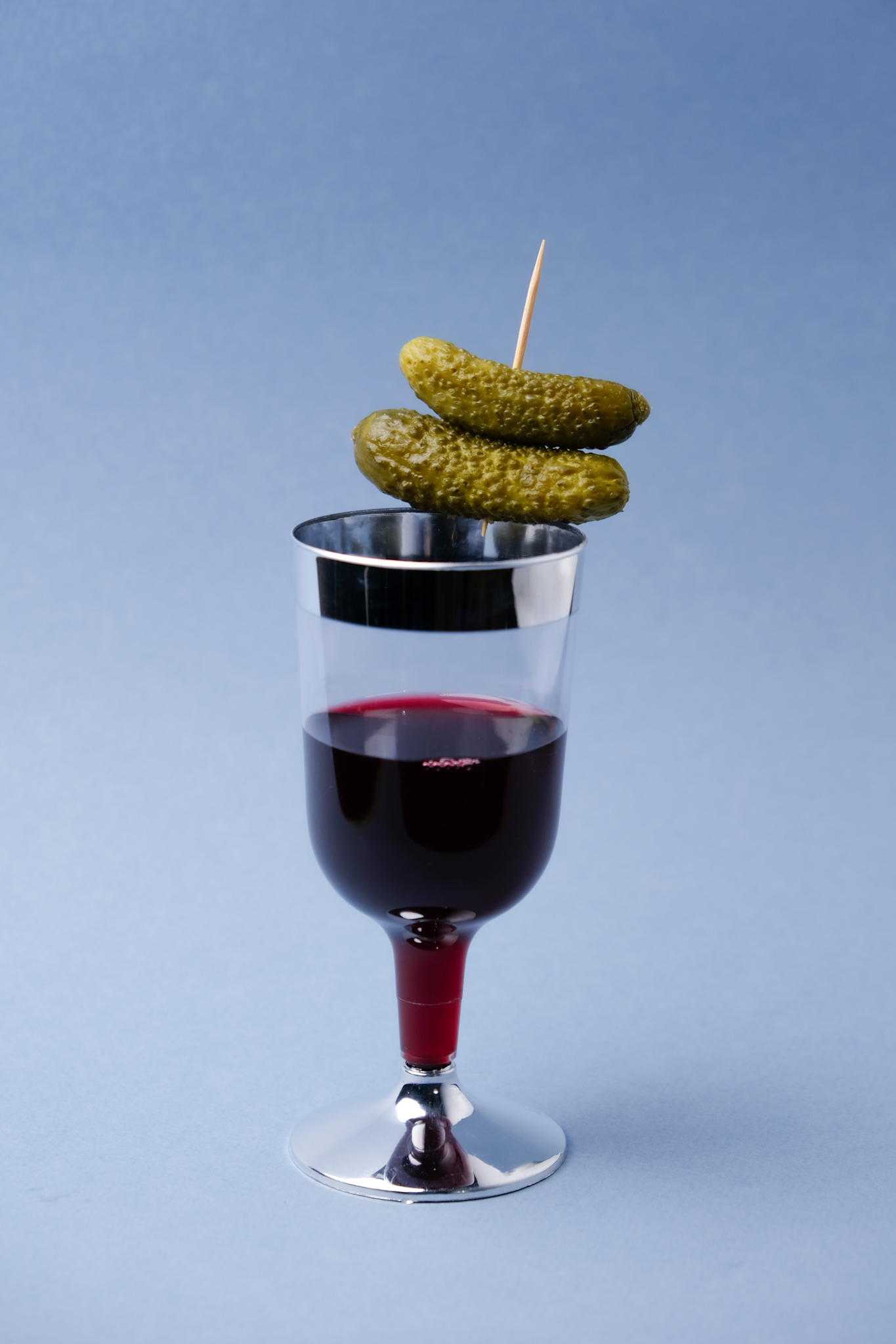 Silver Line Wine Glass with Cornichons on top