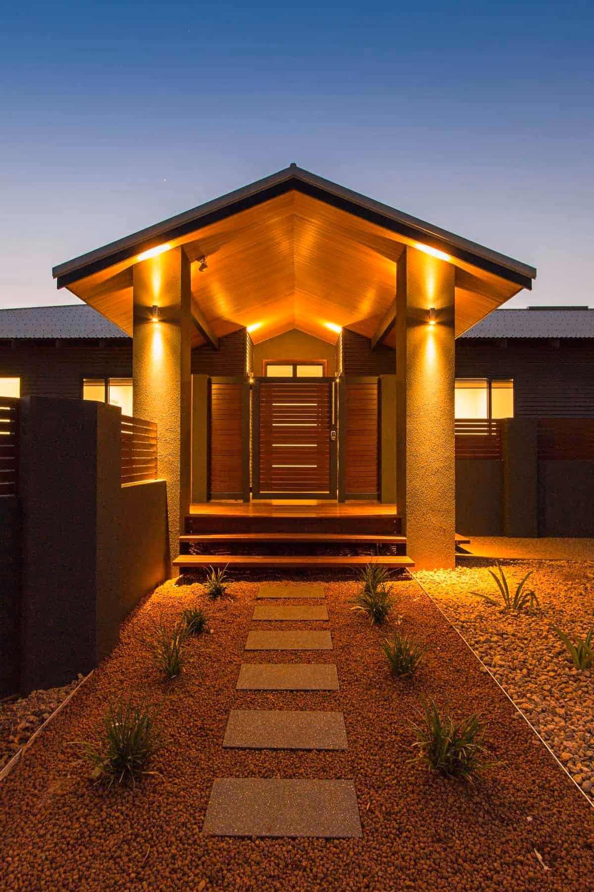 Lit gabled front entry at dusk of the 2017 Best Country Home, Kimberley and Pilbara region