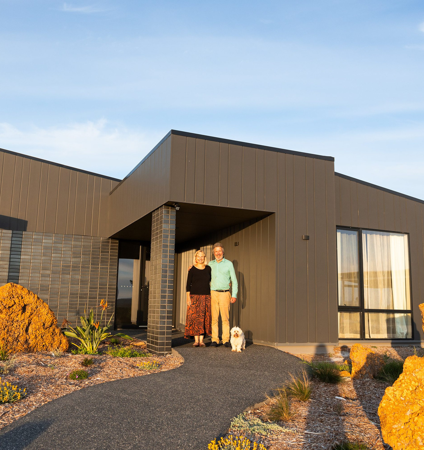 Cheryl and Chris Reid at the front entry of their Great Southern Homes custom build in Denmark, WA