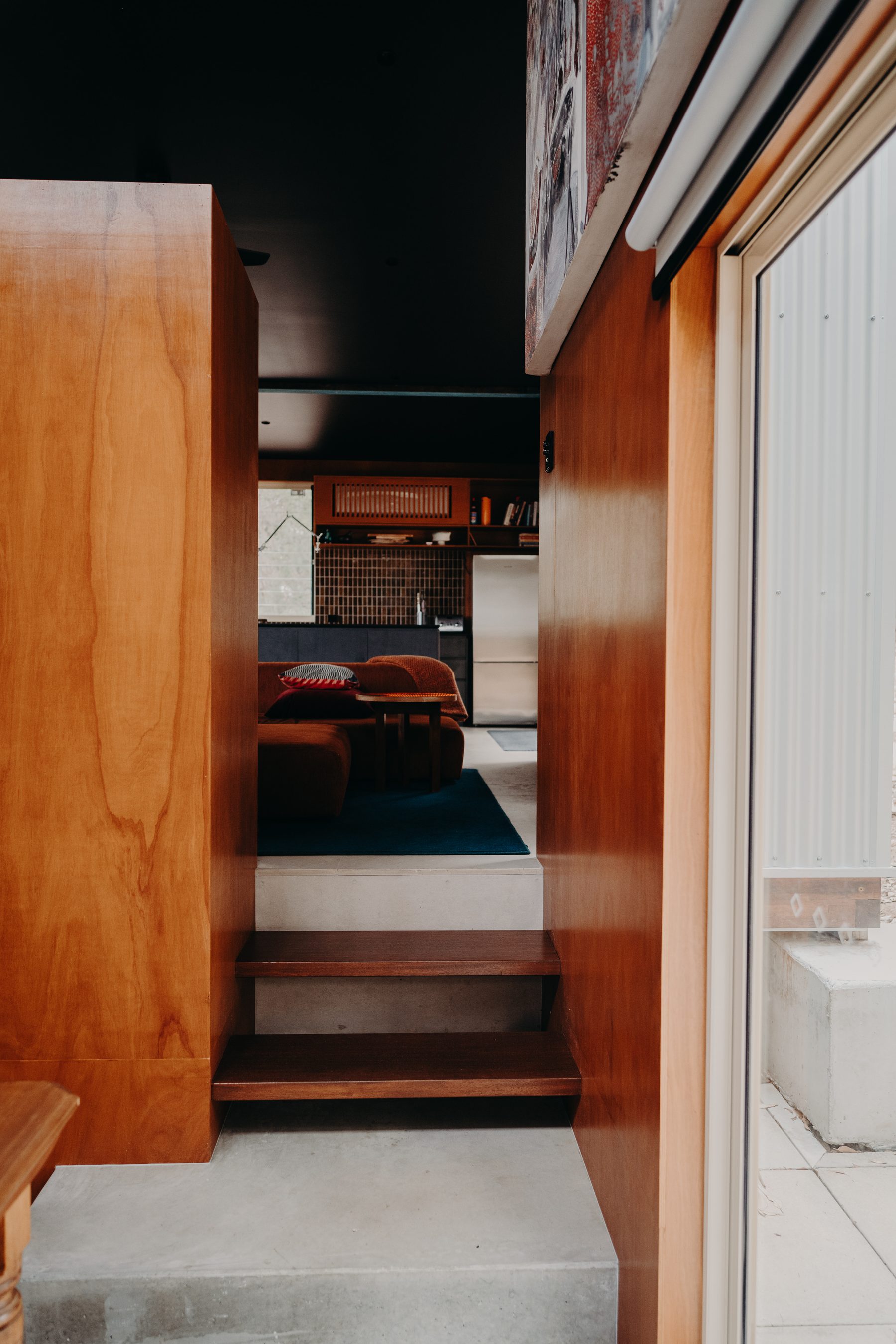 Timber steps joining the original wing to the new living extension of a renovated home in Denmark, WA