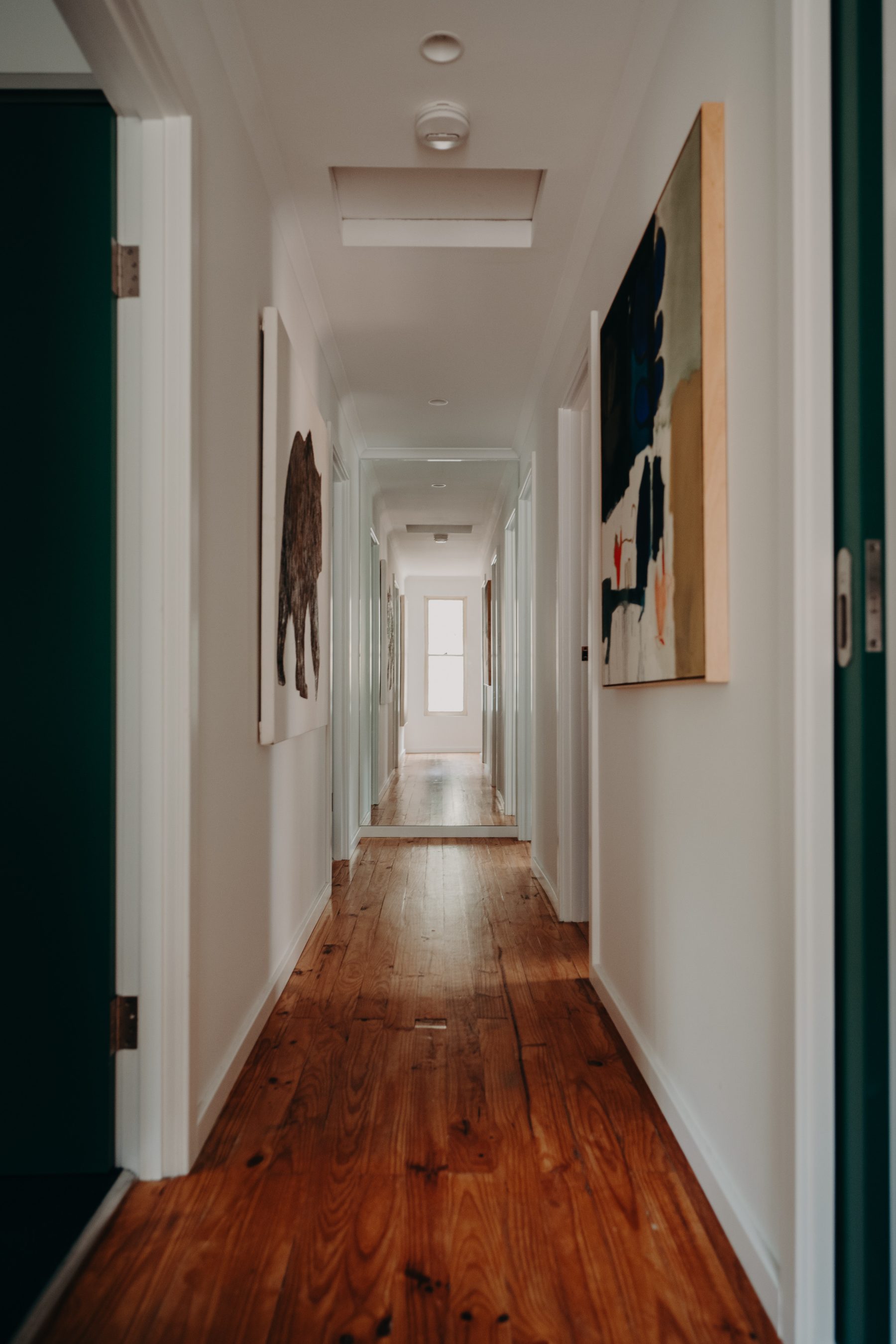 Hallway in the original wing of an older Great Southern home with restored pine floorboards