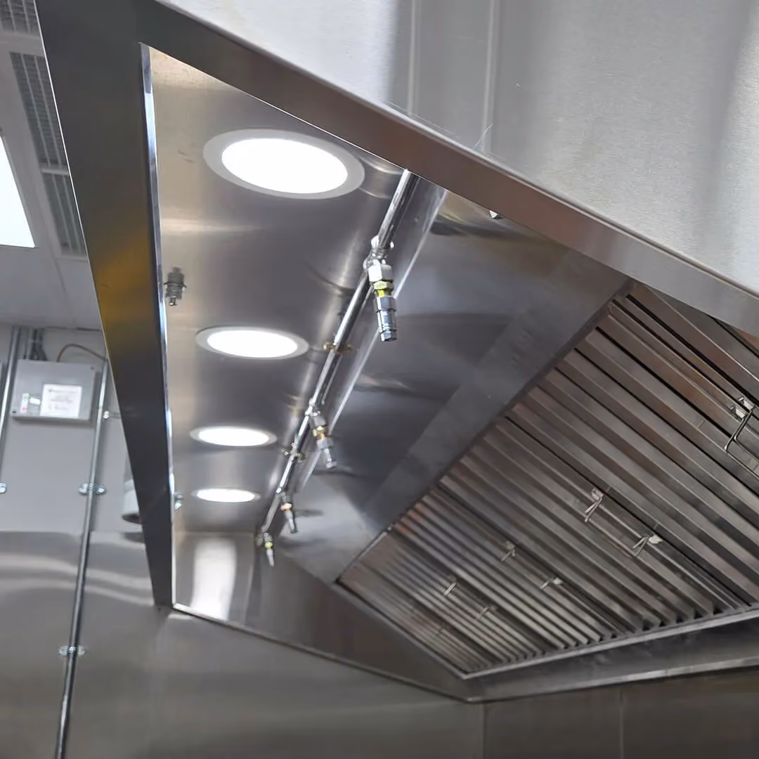 A kitchen hood suppression system installed in a commercial kitchen.