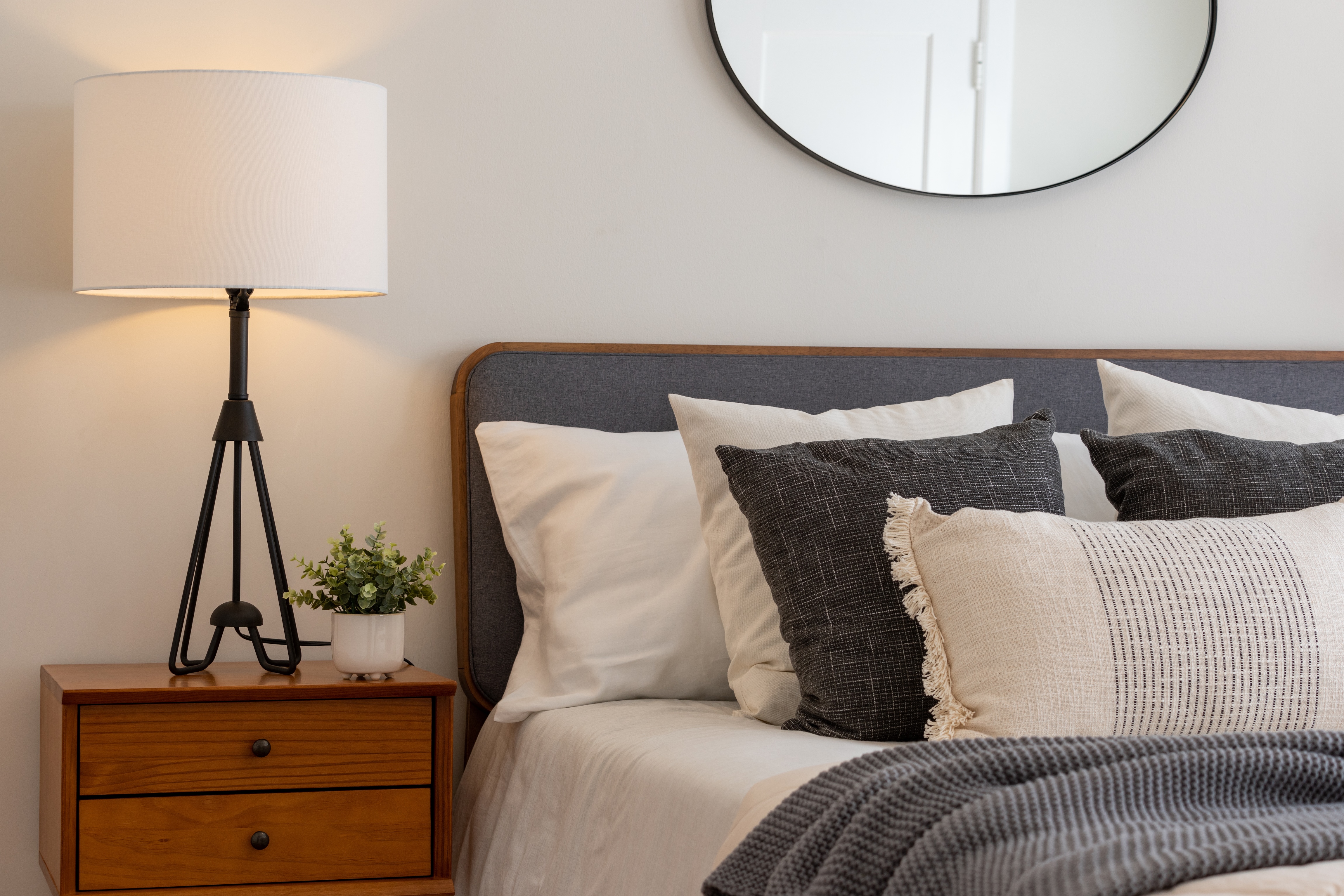 Bed with nightstand stock image