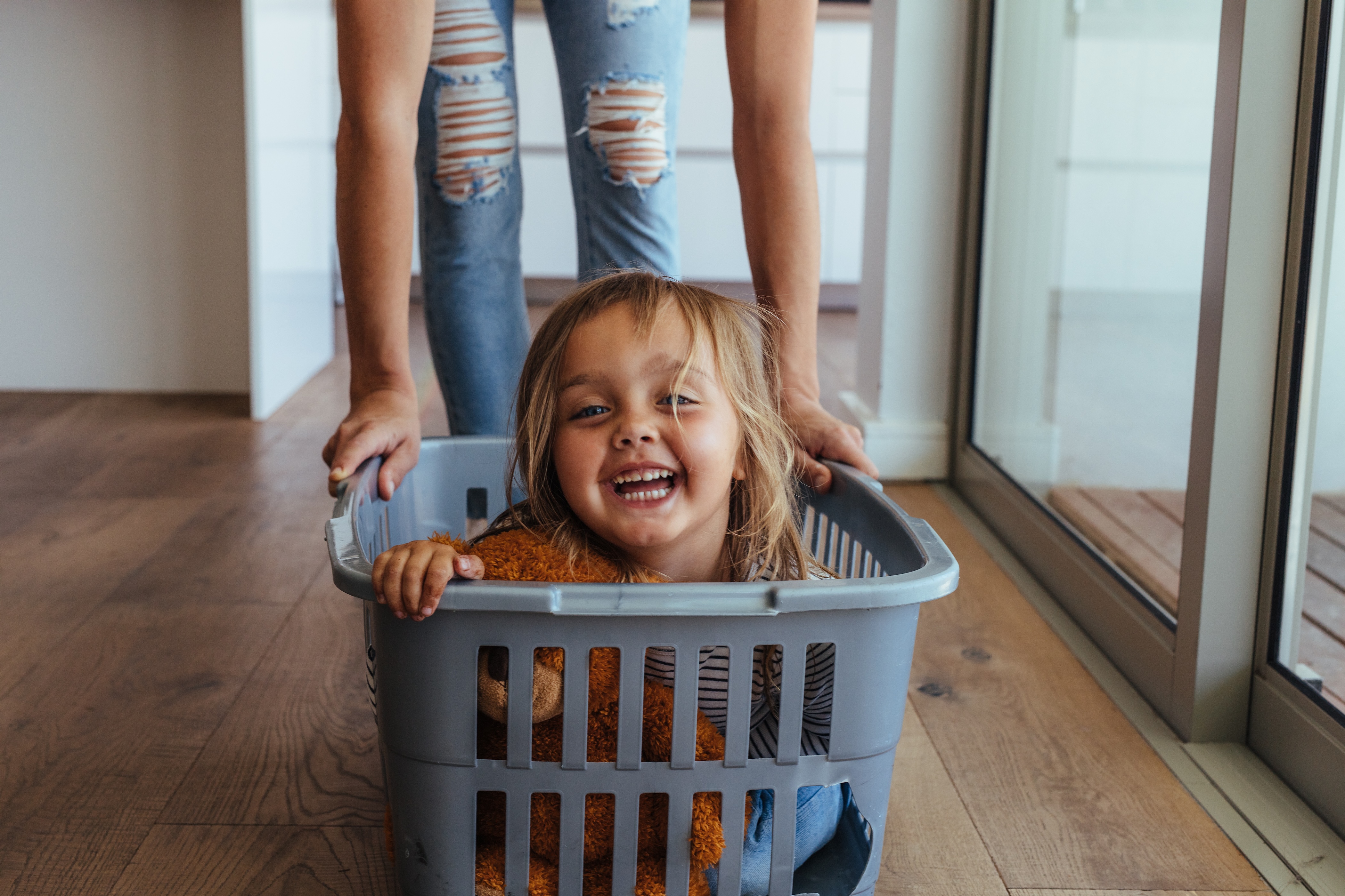 Kid in the laundry basket stock image