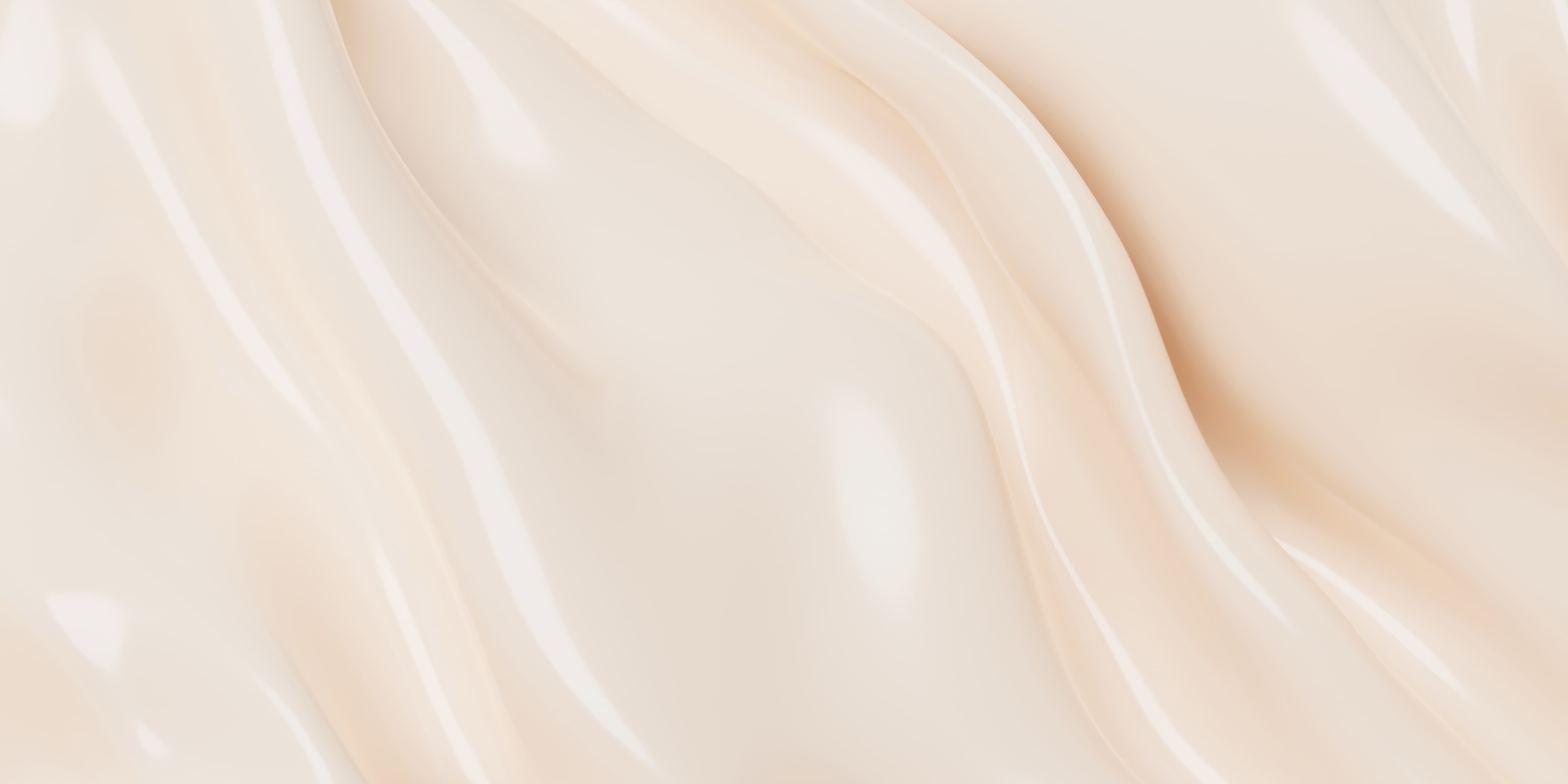 Close-up of a smooth, creamy beige liquid texture with flowing, glossy swirls and highlights.
