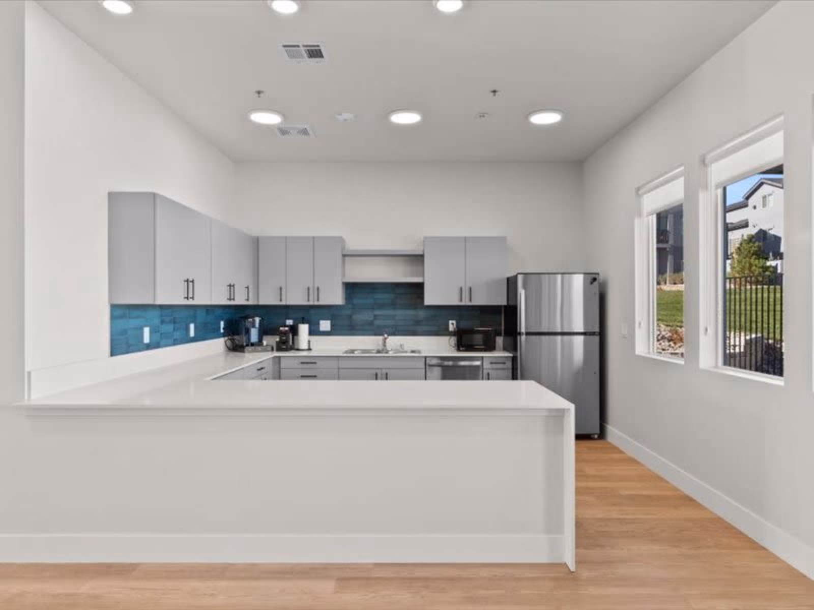 Residents lounge kitchen area with stainless steel appliances