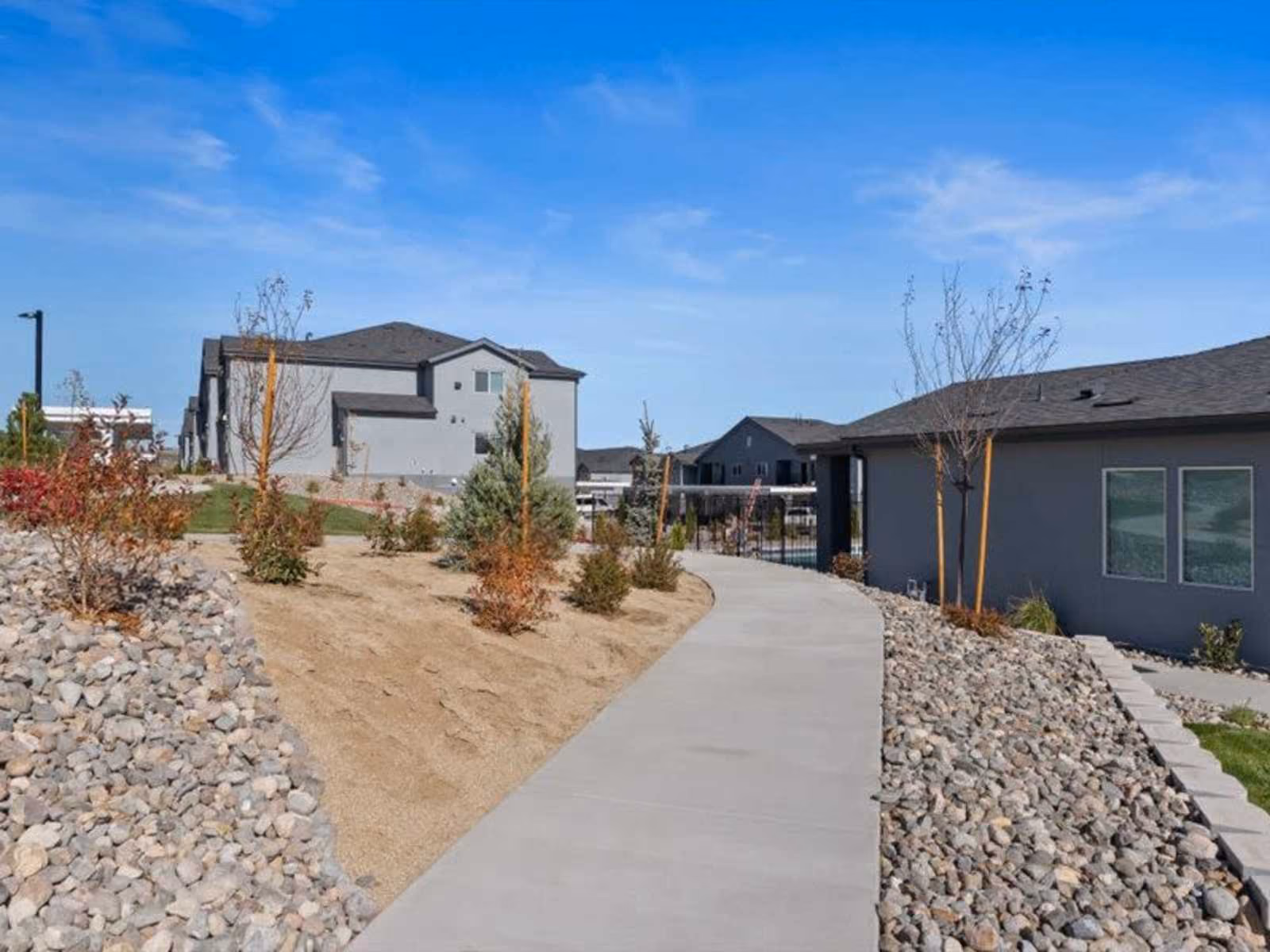 Exterior view of apartments and into gated pool area