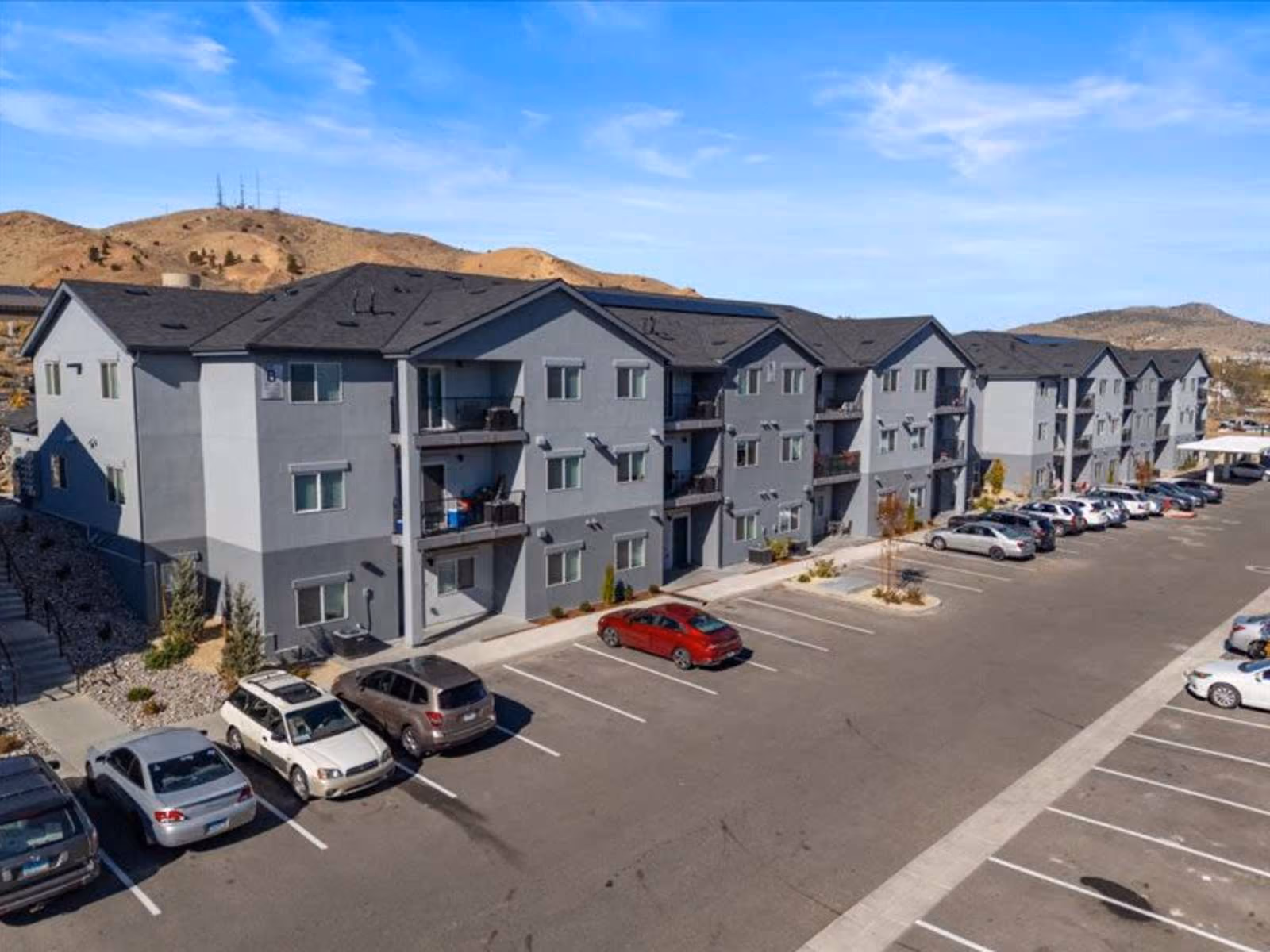 Exterior with view of parking lot and mountains in surrounding area
