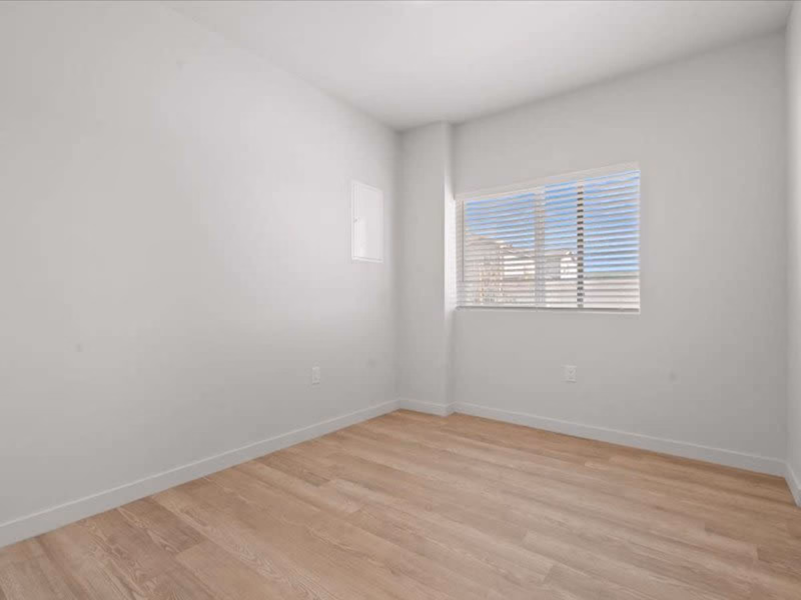 Unfurnished bedroom with large window