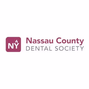 Logo for Nassau County Dental Society featuring a maroon square with white 'NY' and a stylized tooth flame, next to the text 'Nassau County' in maroon and 'DENTAL SOCIETY' in gray.