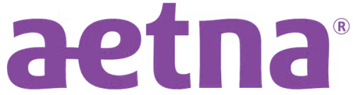 Aetna logo in lowercase purple letters on a transparent background.