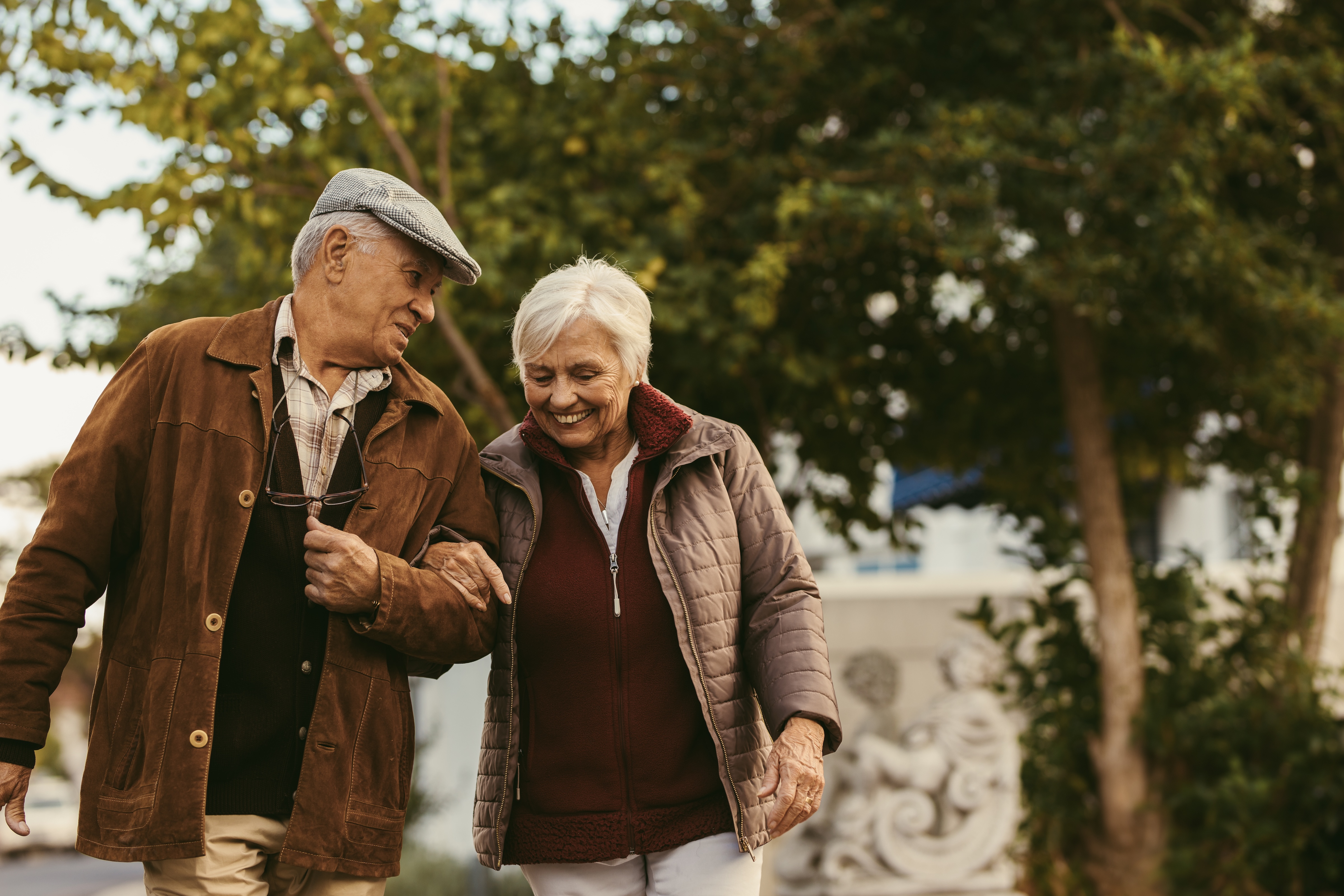 Man and woman walking outside stock image