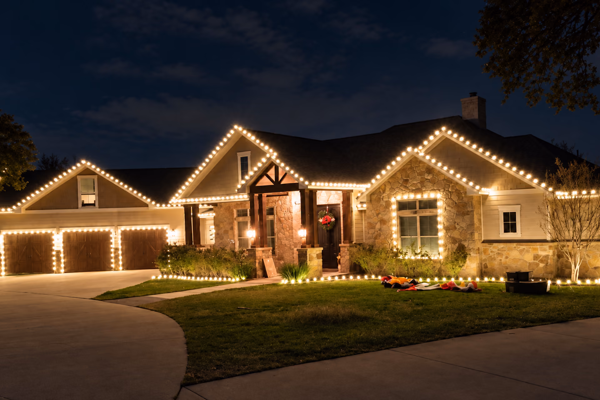 Professional holiday lighting display by Bluebonnet Turf Co.  
