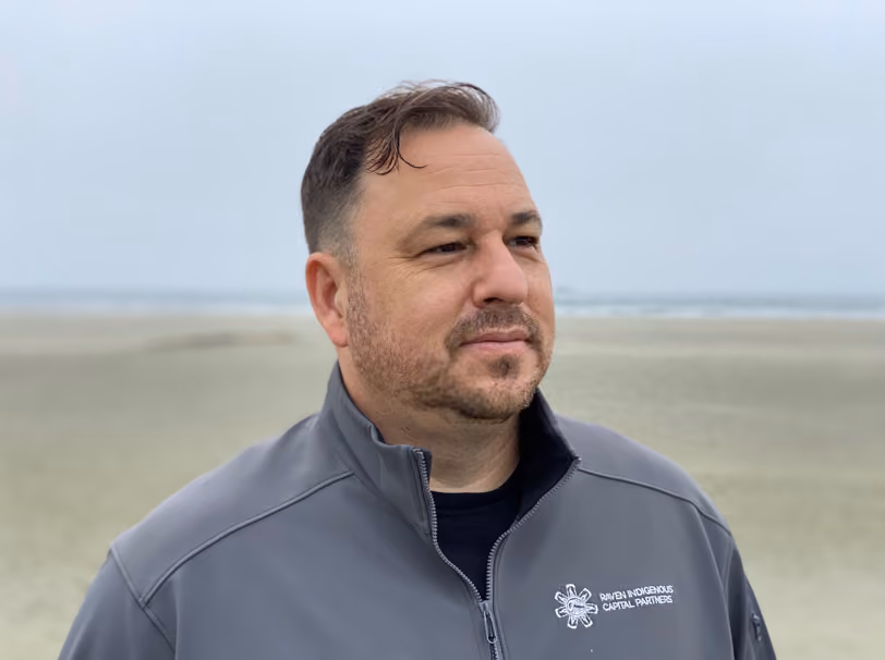 Jeff Cyr stands on beach.