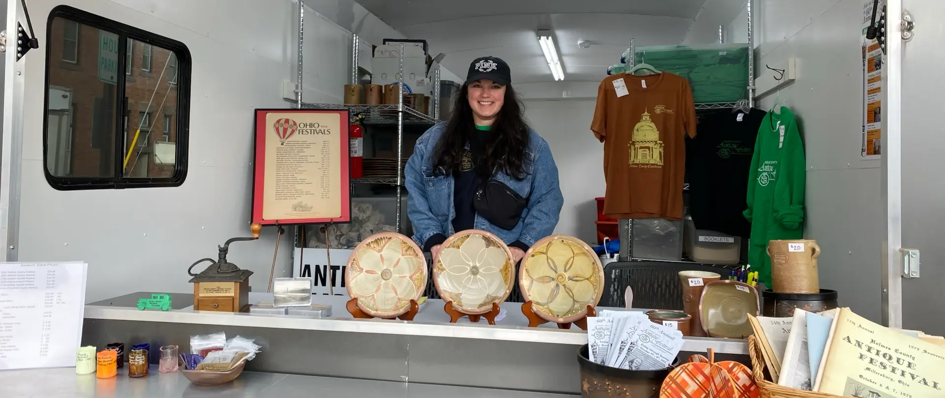 antique vendor set up plates and other items