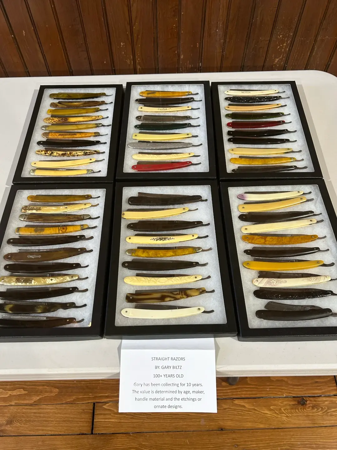 boxes of antique pocket knives in a row