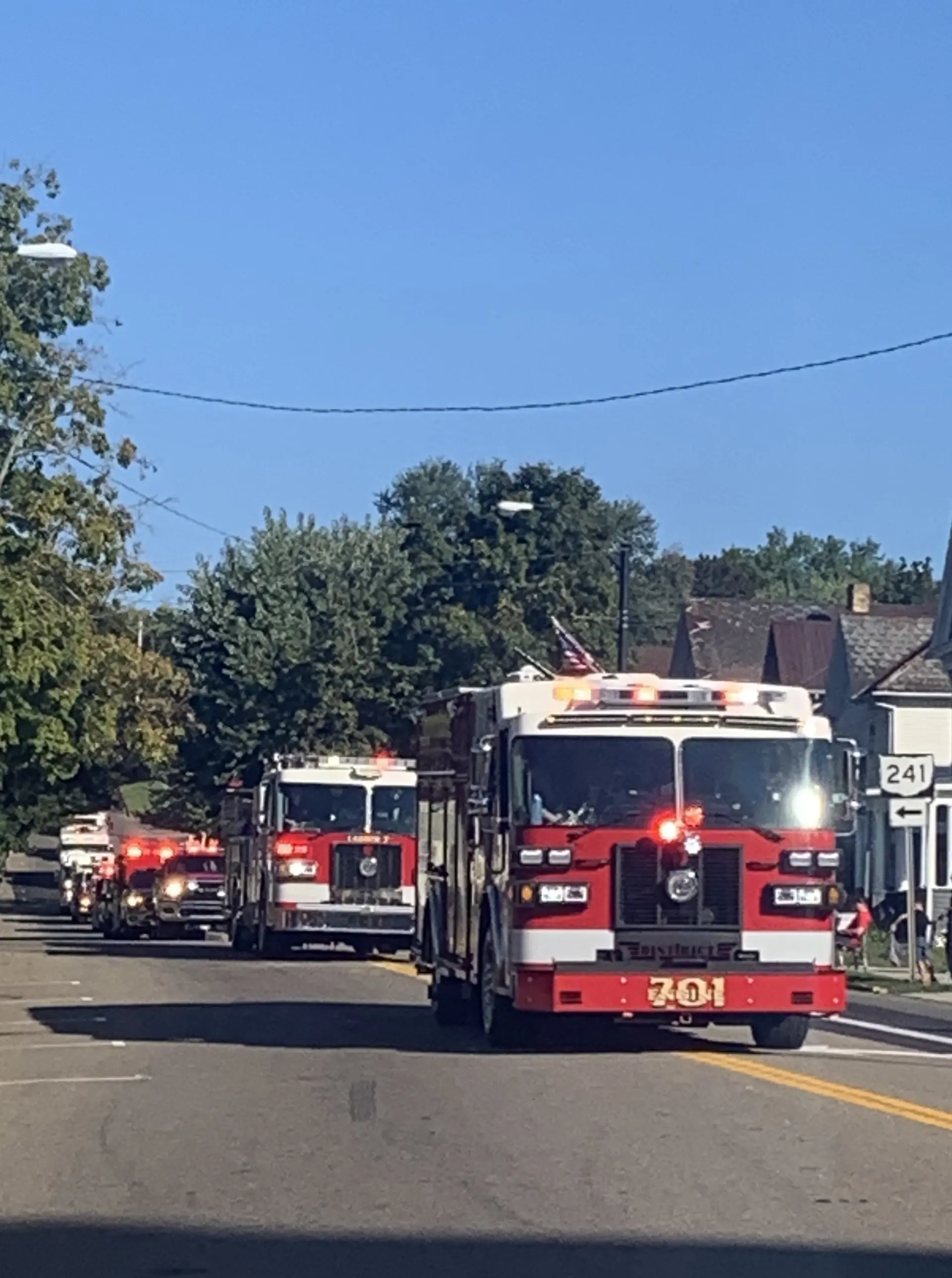 line of fire trucks in parade