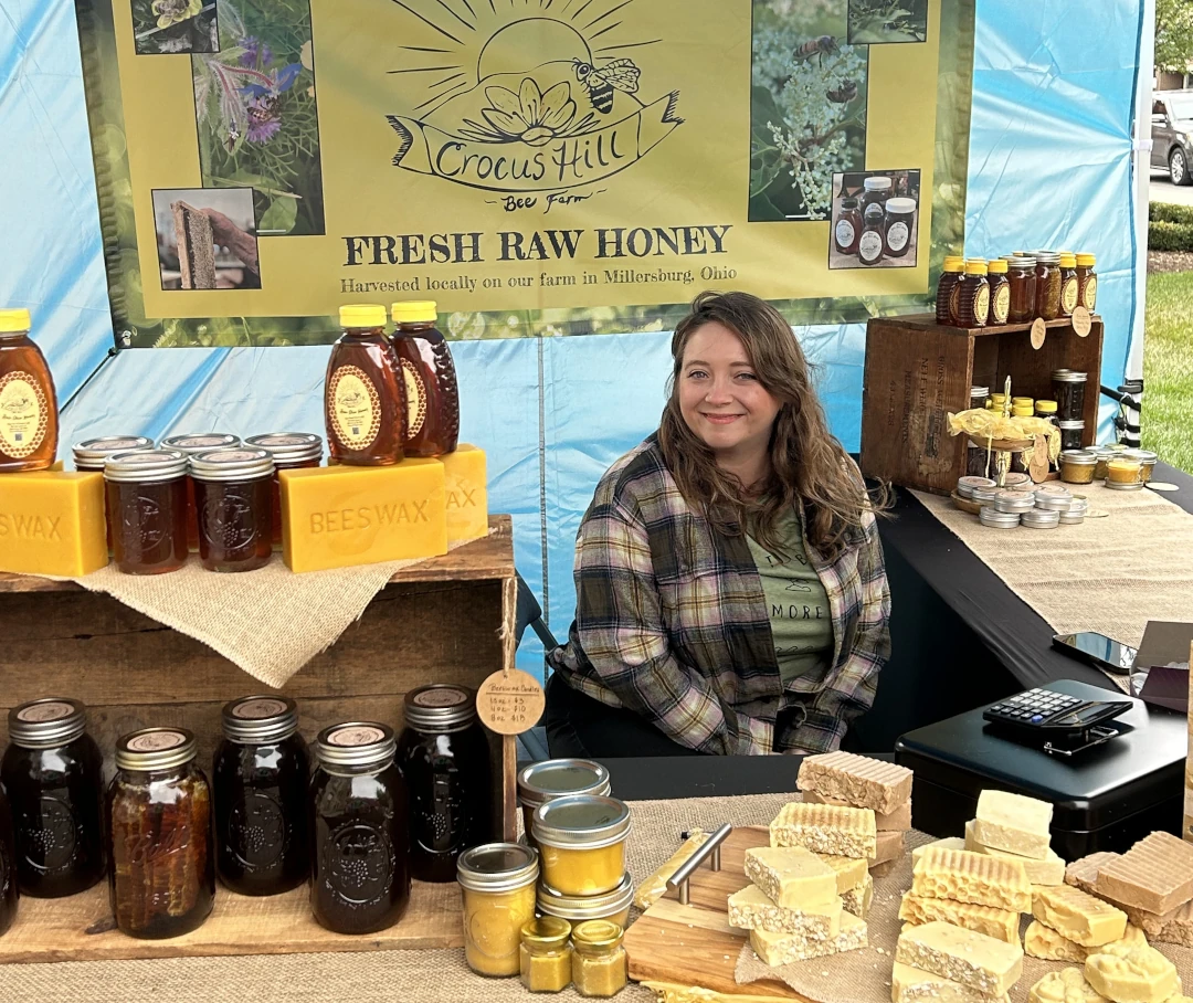 honey vendor smiling