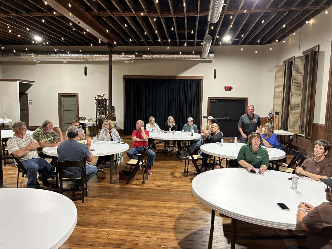 people sitting around round tables