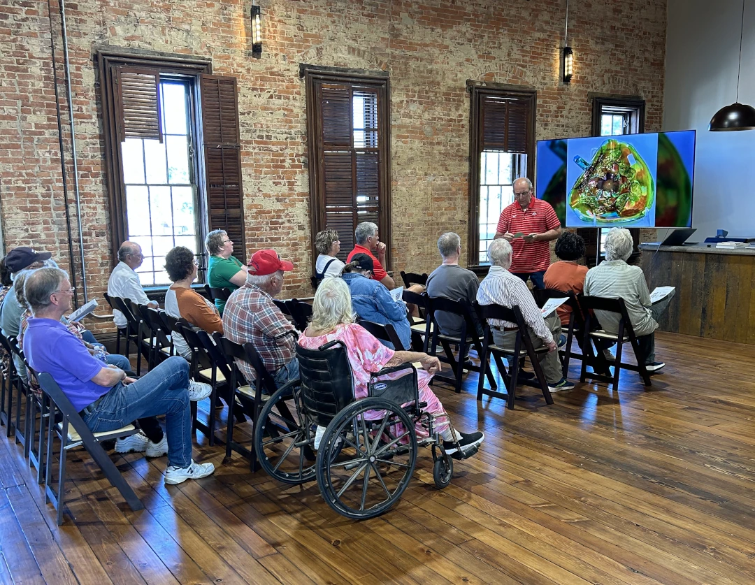 group sitting together listening to a presentation