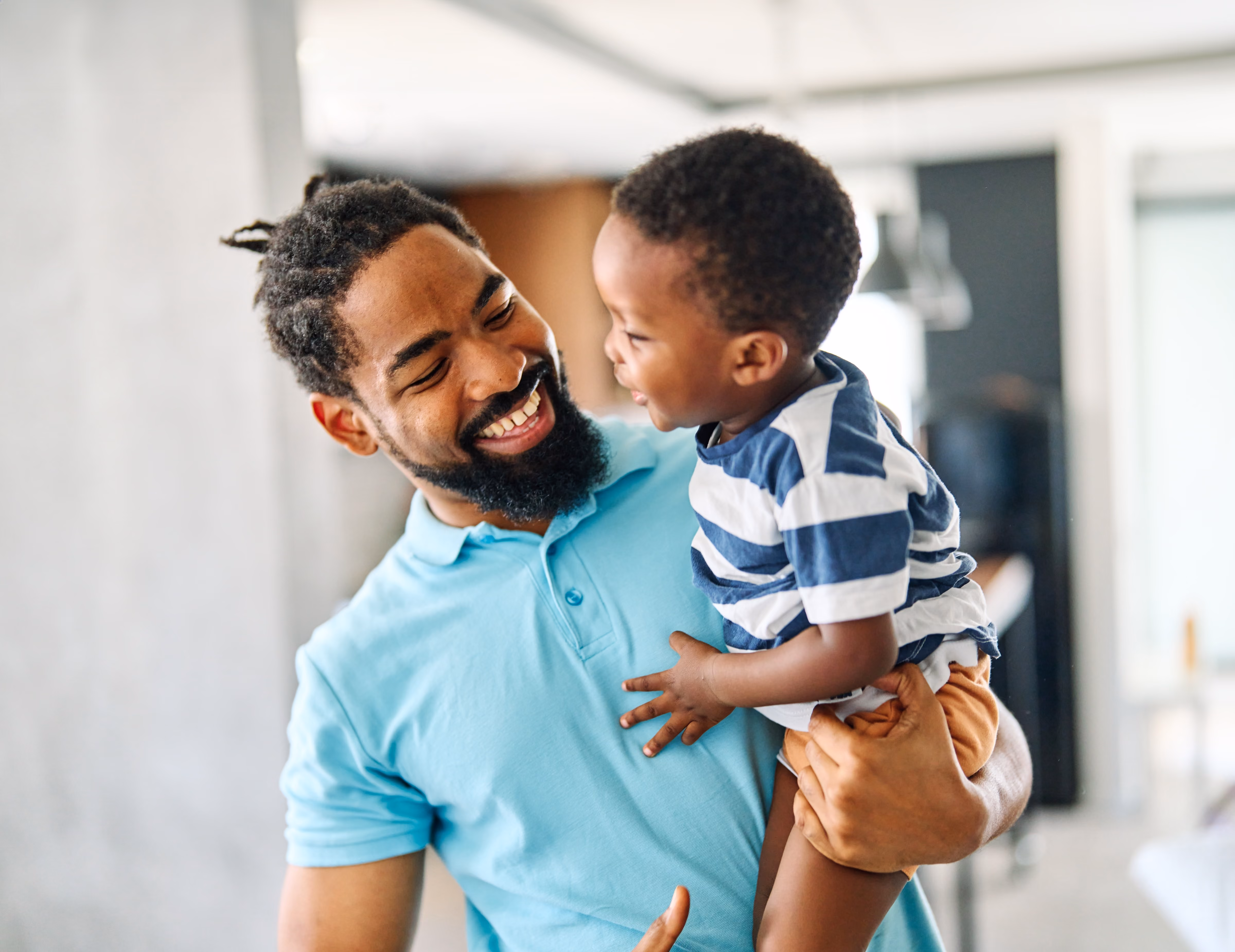 Man holding boy stock image