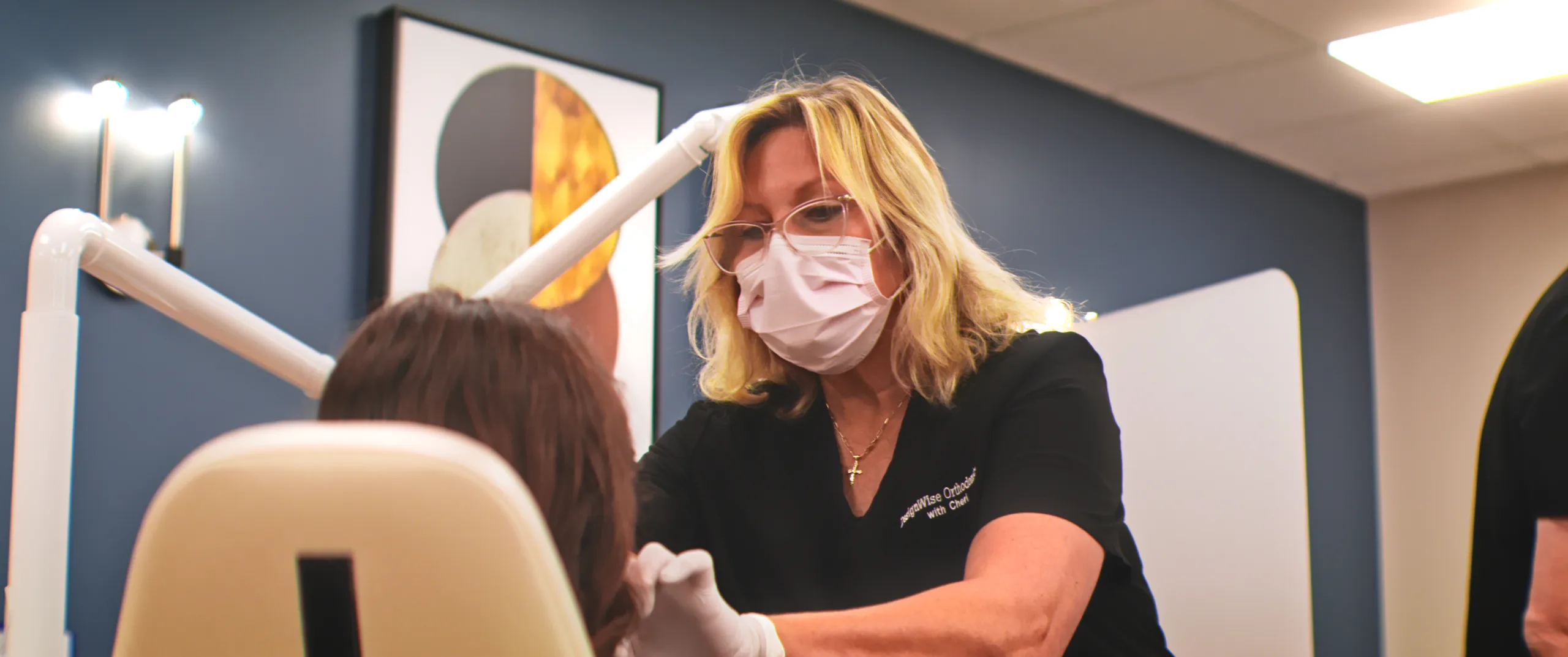 A DesignWise team member caring for a patient