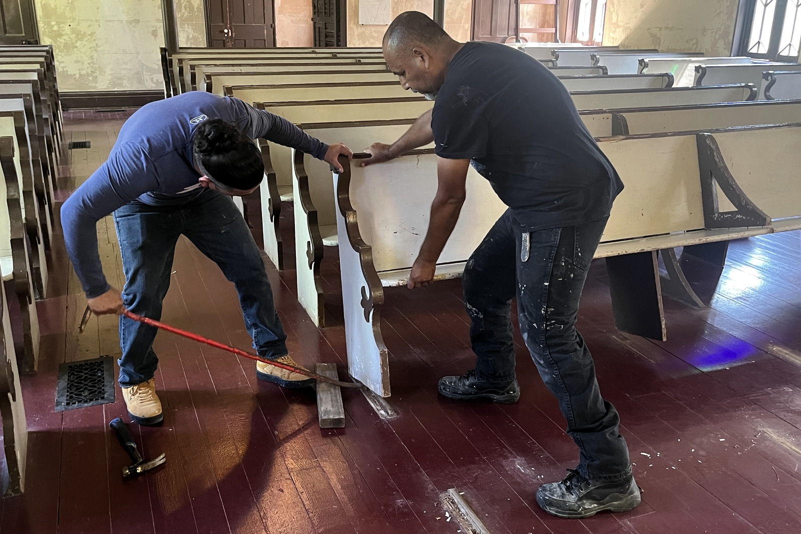 Hands-on preservation work on a historic Christ Church pew.