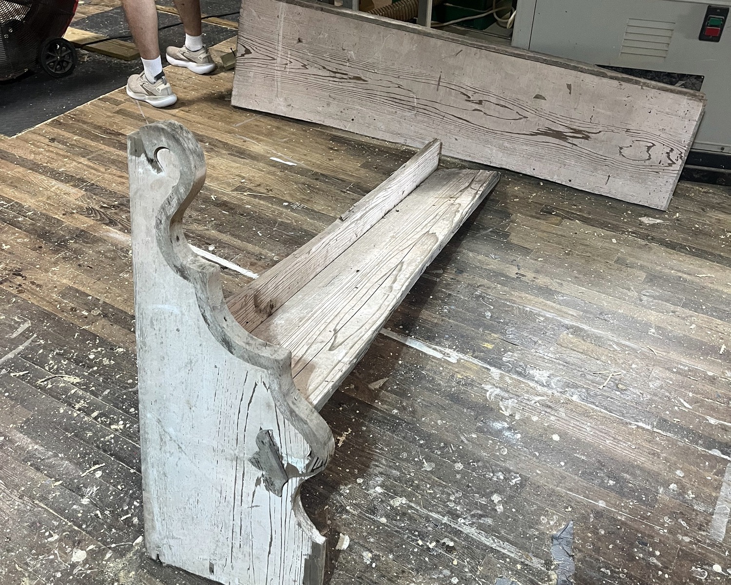 A historic Christ Church pew undergoing restoration and repair.