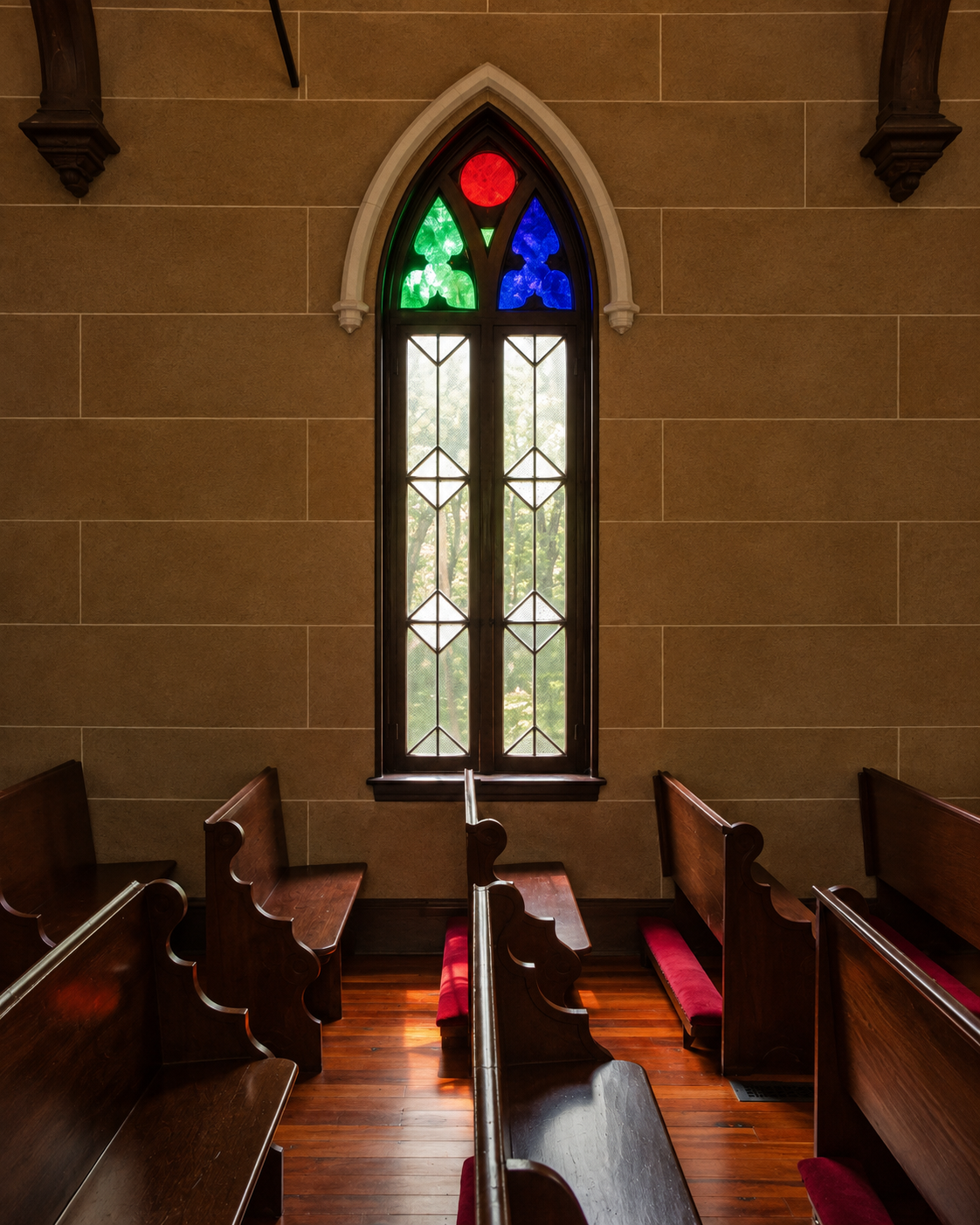 Light beside a stained-glass window in Christ Church.
