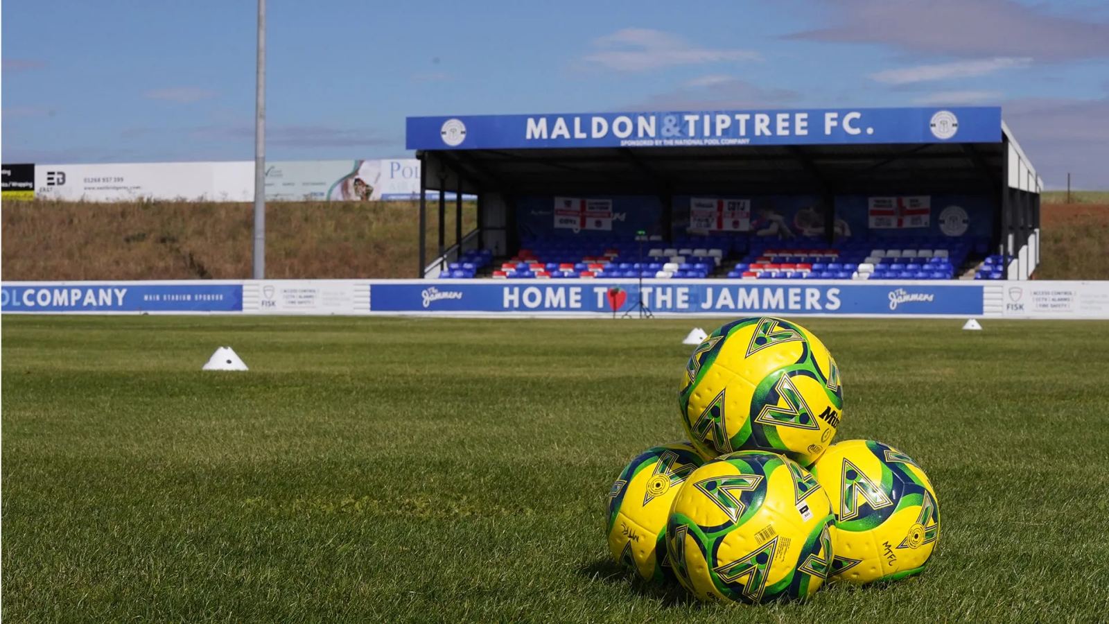 Match balls on the pitch at The Maldon Stadium