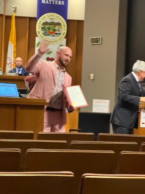 Dr. Corey Blanchette receiving a City of San Leandro award at San Leandro City Hall, June 2026