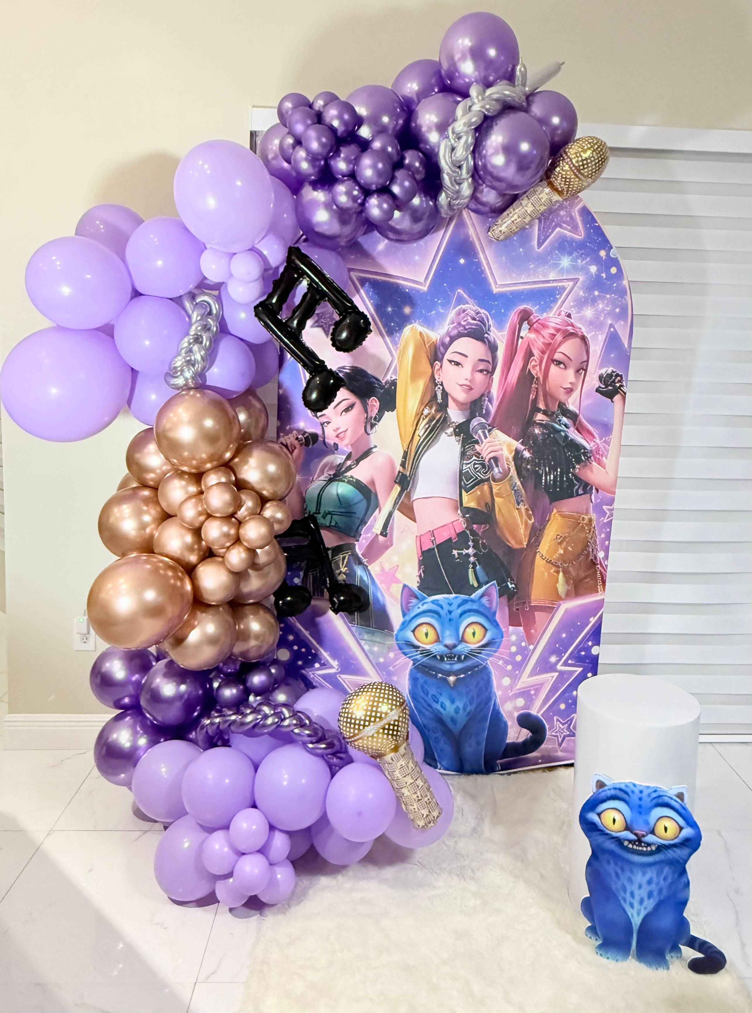 K-pop-themed party backdrop with lavender, purple, rose-gold and silver balloons.