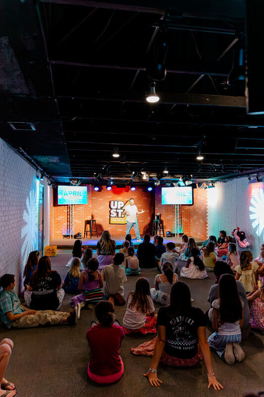 Elementary kids laughing together in UpStreet