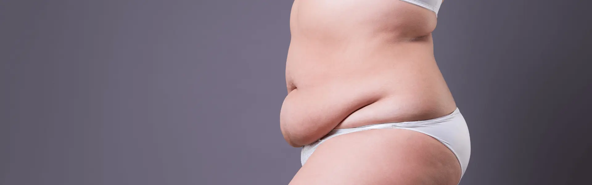 Side view of a person's abdomen