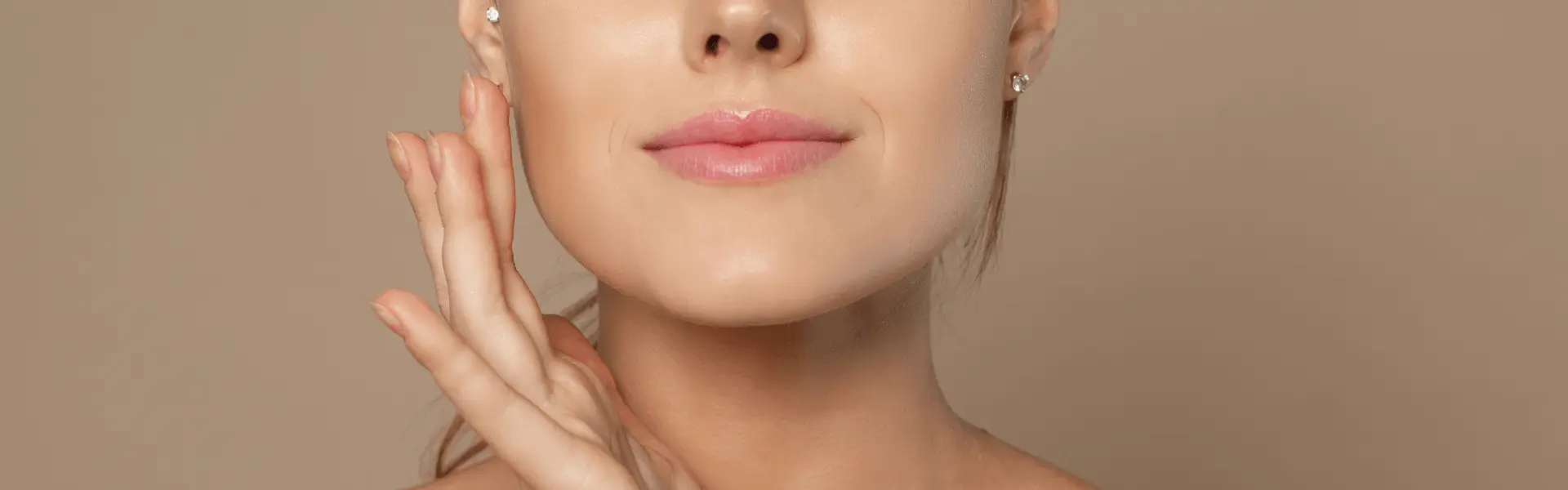Woman resting one hand beside her cheek and chin.