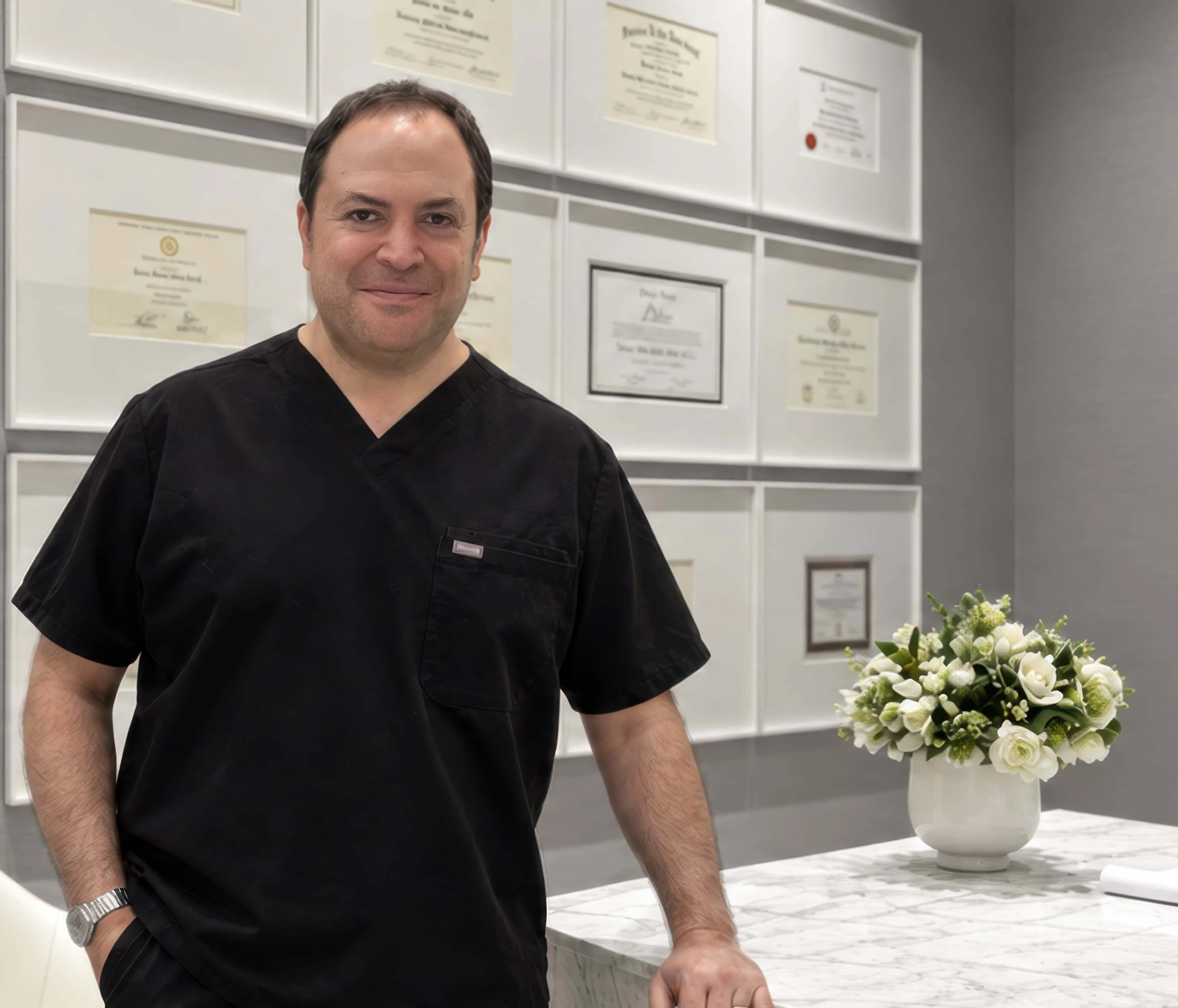 Darren M. Smith, MD, FACS, in black scrubs