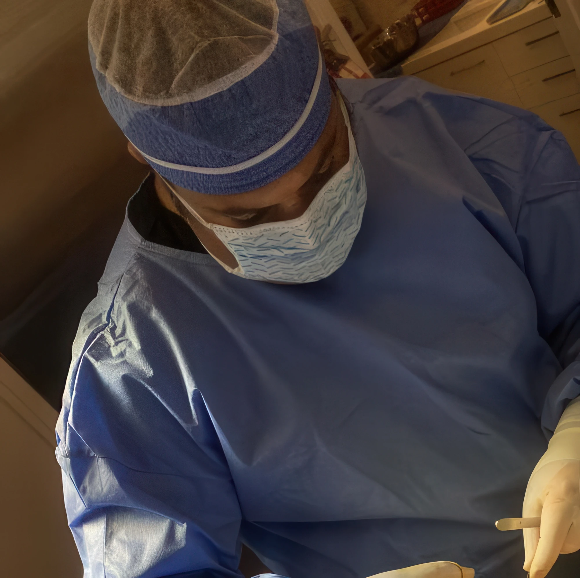 Darren M. Smith, MD, FACS in surgical attire during a procedure.
