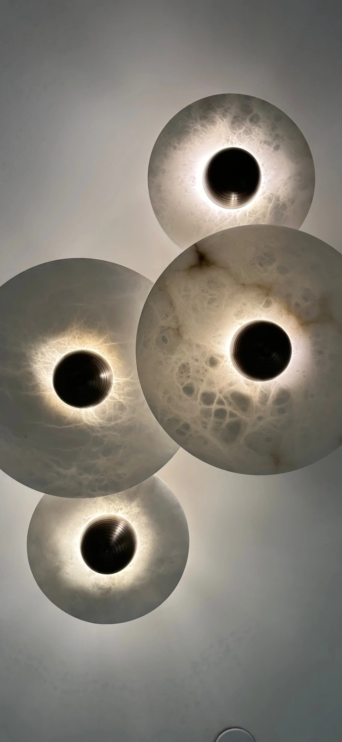 Sculptural circular ceiling lights in the practice.