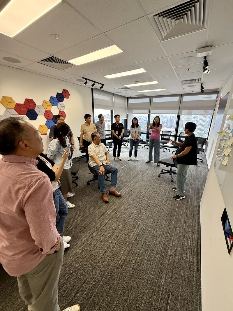 Team members in an interactive coaching activity