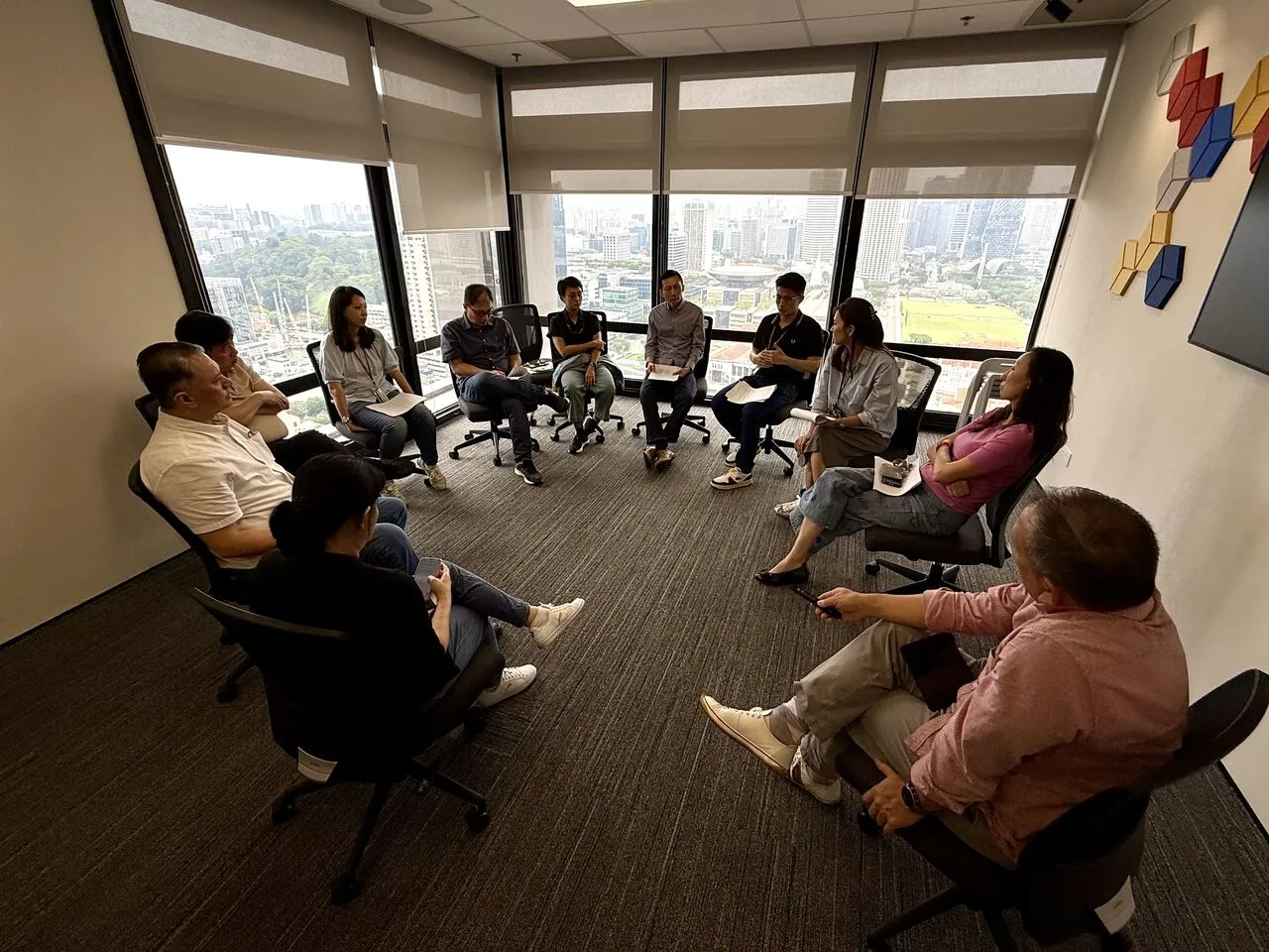 A leadership team in a circle during a team coaching session