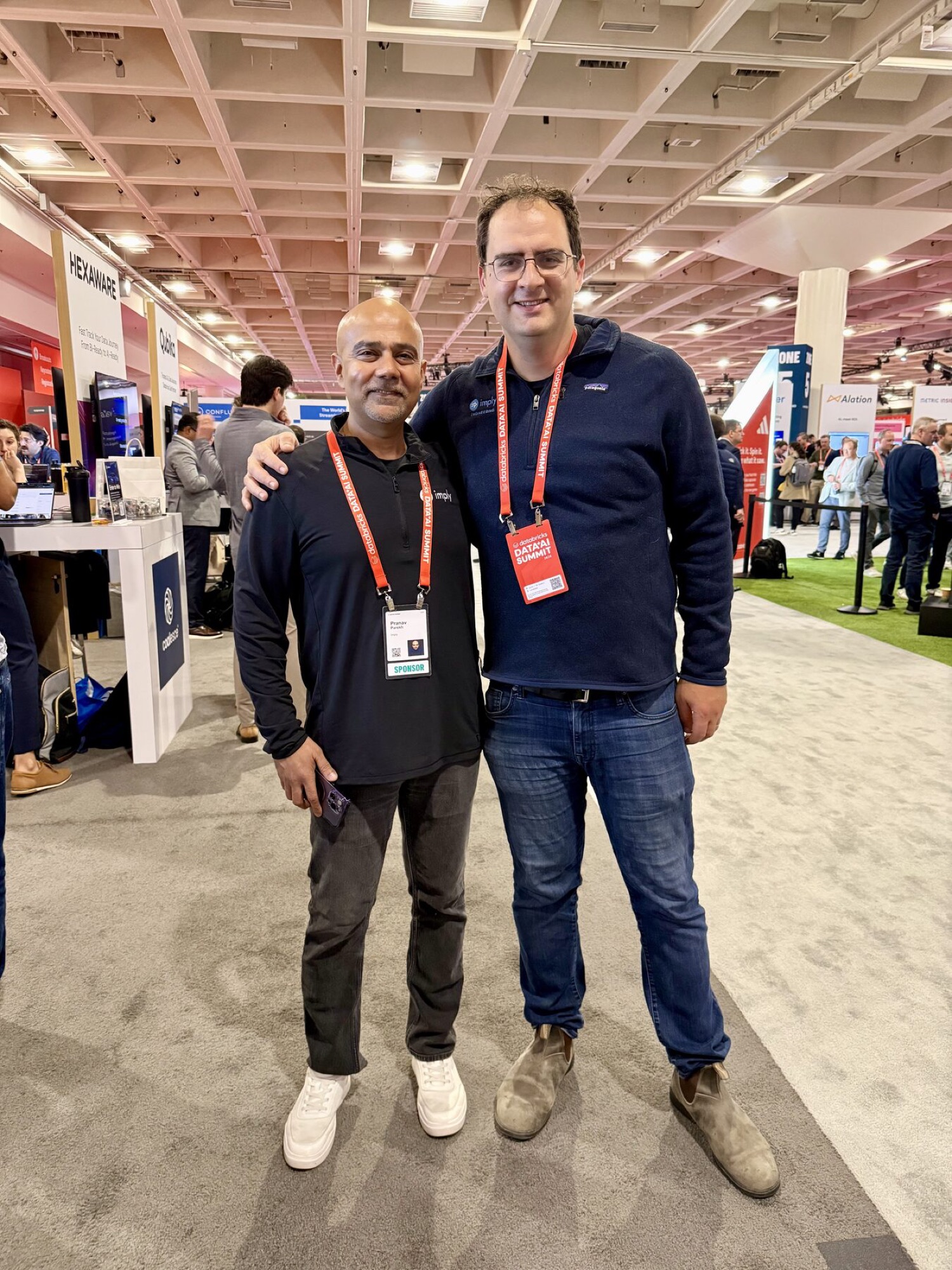 Two Imply team members together at an industry conference