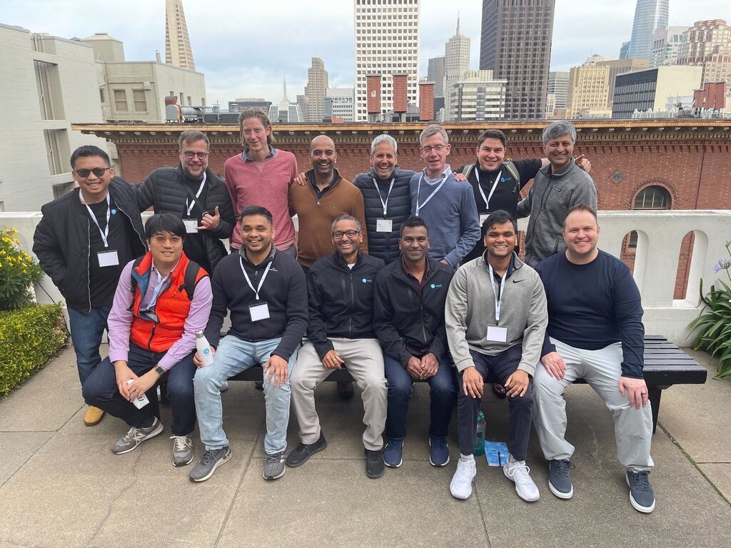 The Imply team gathered on a rooftop