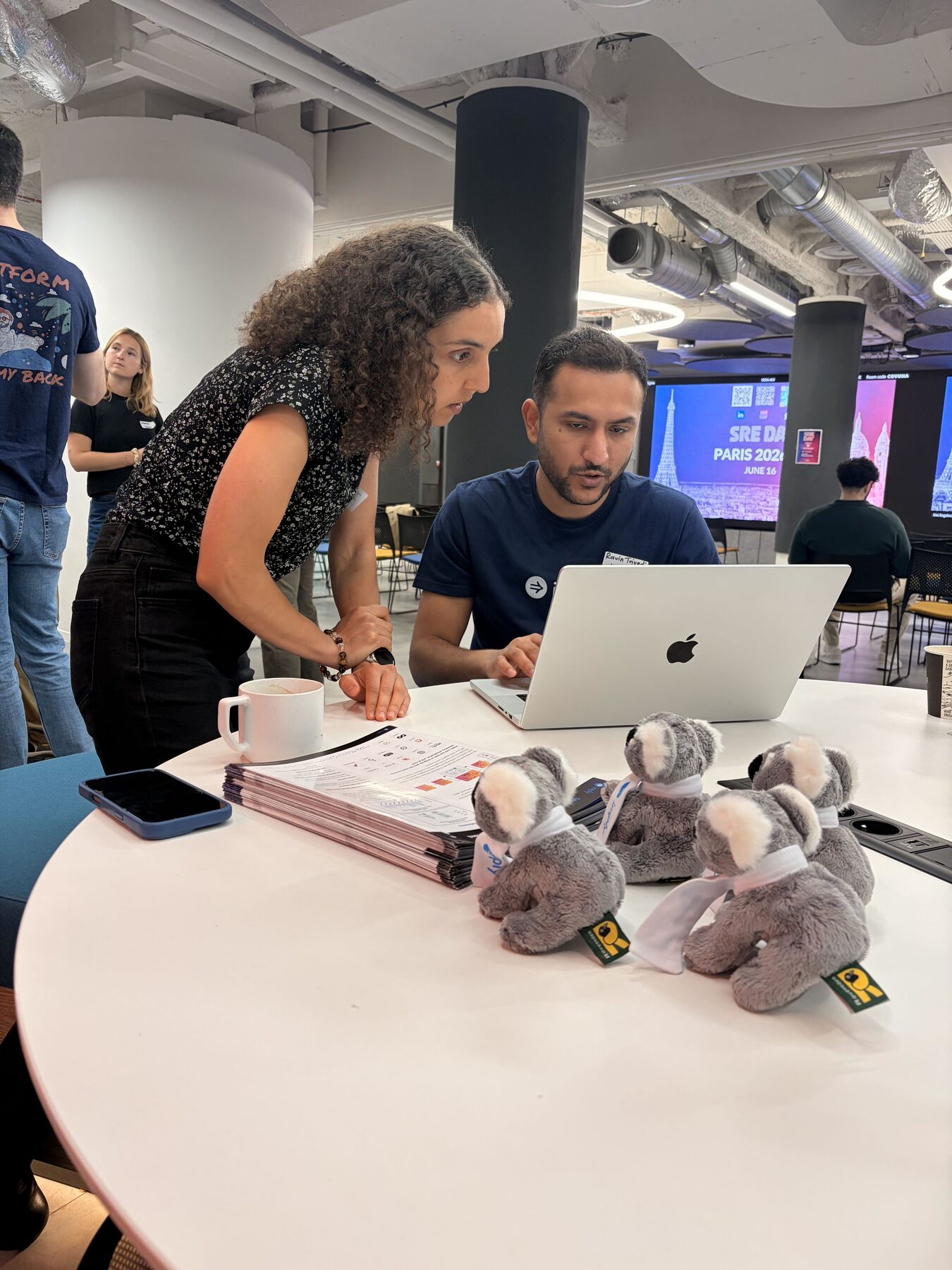 Imply team members working together at a table