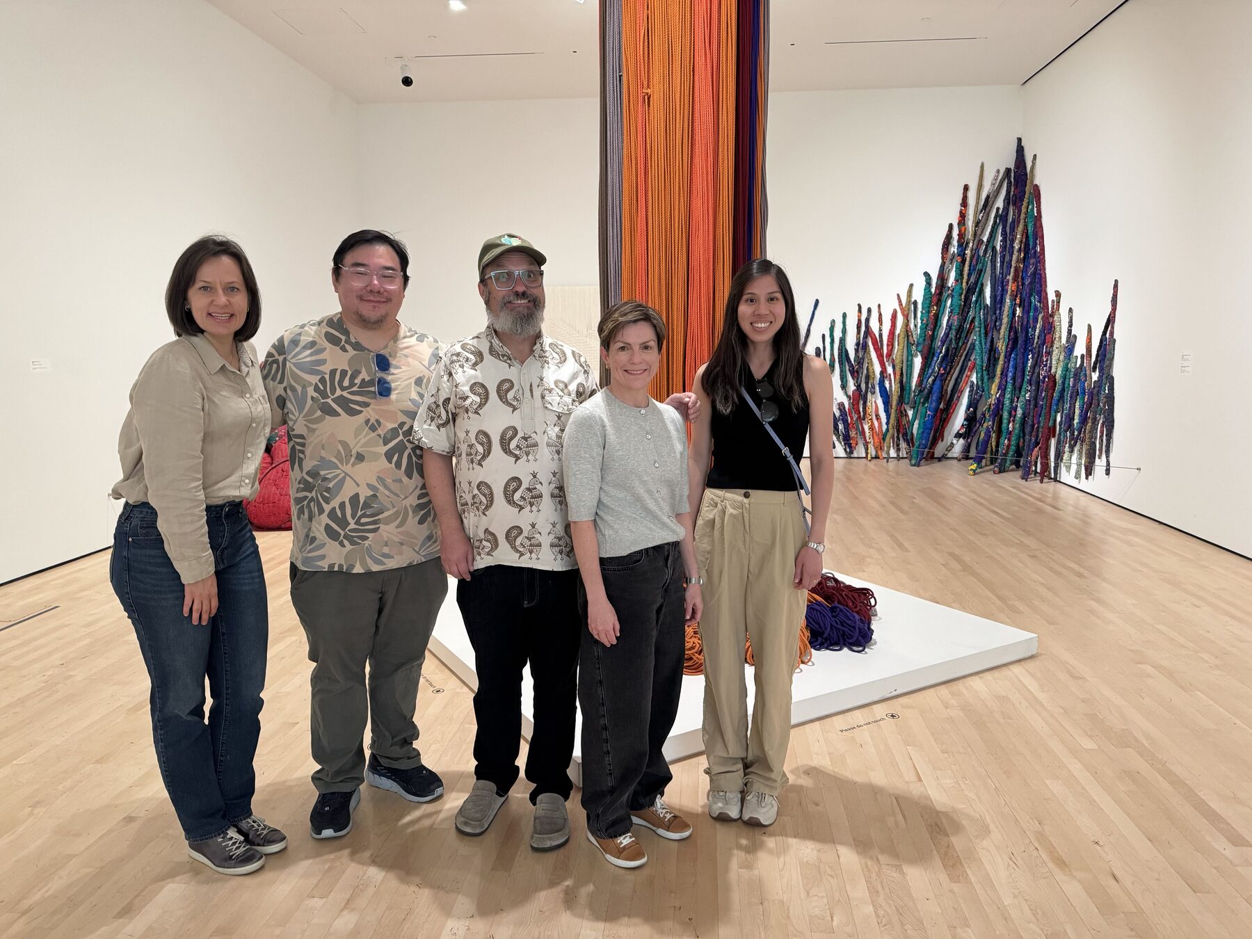Imply team members together at an art gallery
