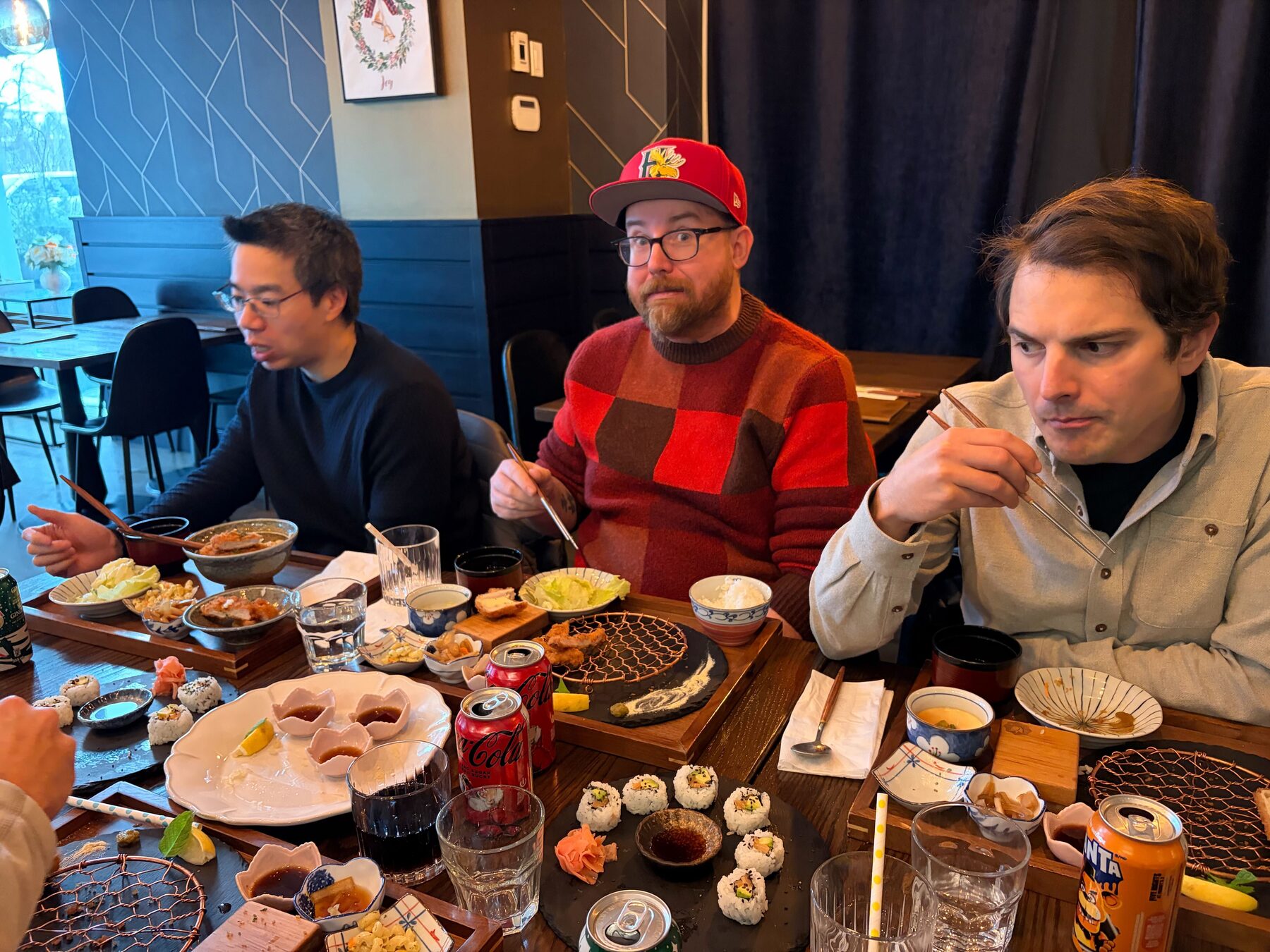 Imply team members laughing together over dinner