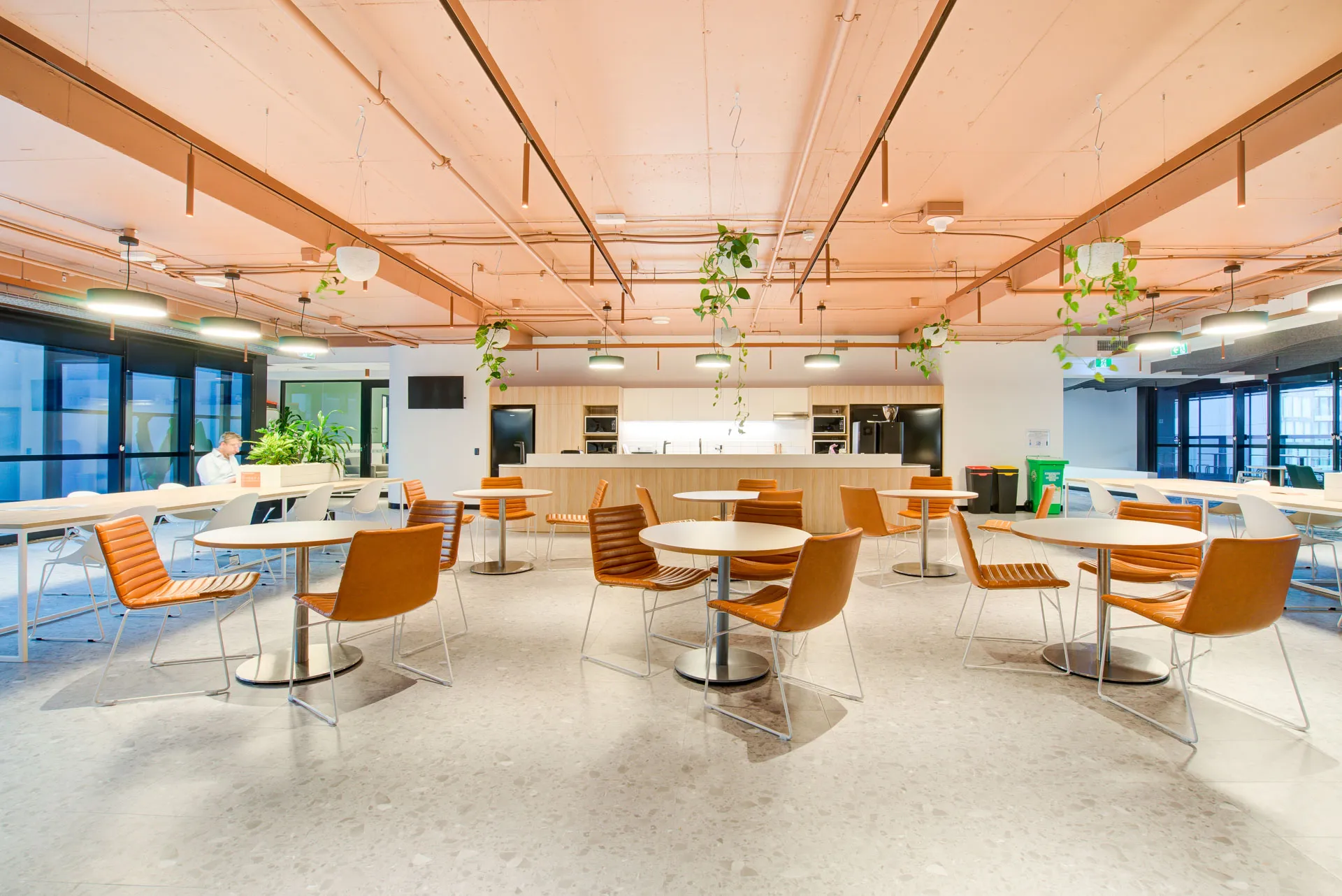 Commercial breakout and cafe space with seamless terrazzo-look flooring