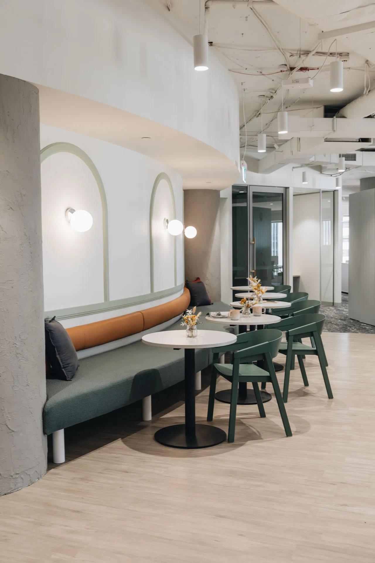 Breakout dining area with timber-look vinyl flooring at 240 Queen Street, Brisbane