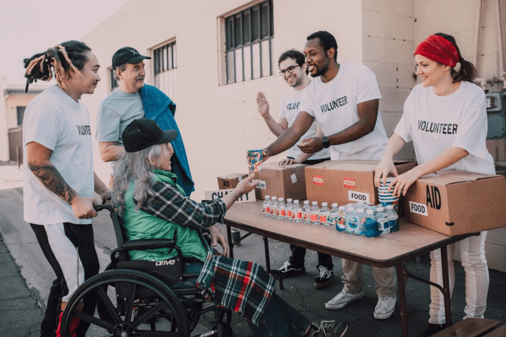 volunteers assist community members outdoors